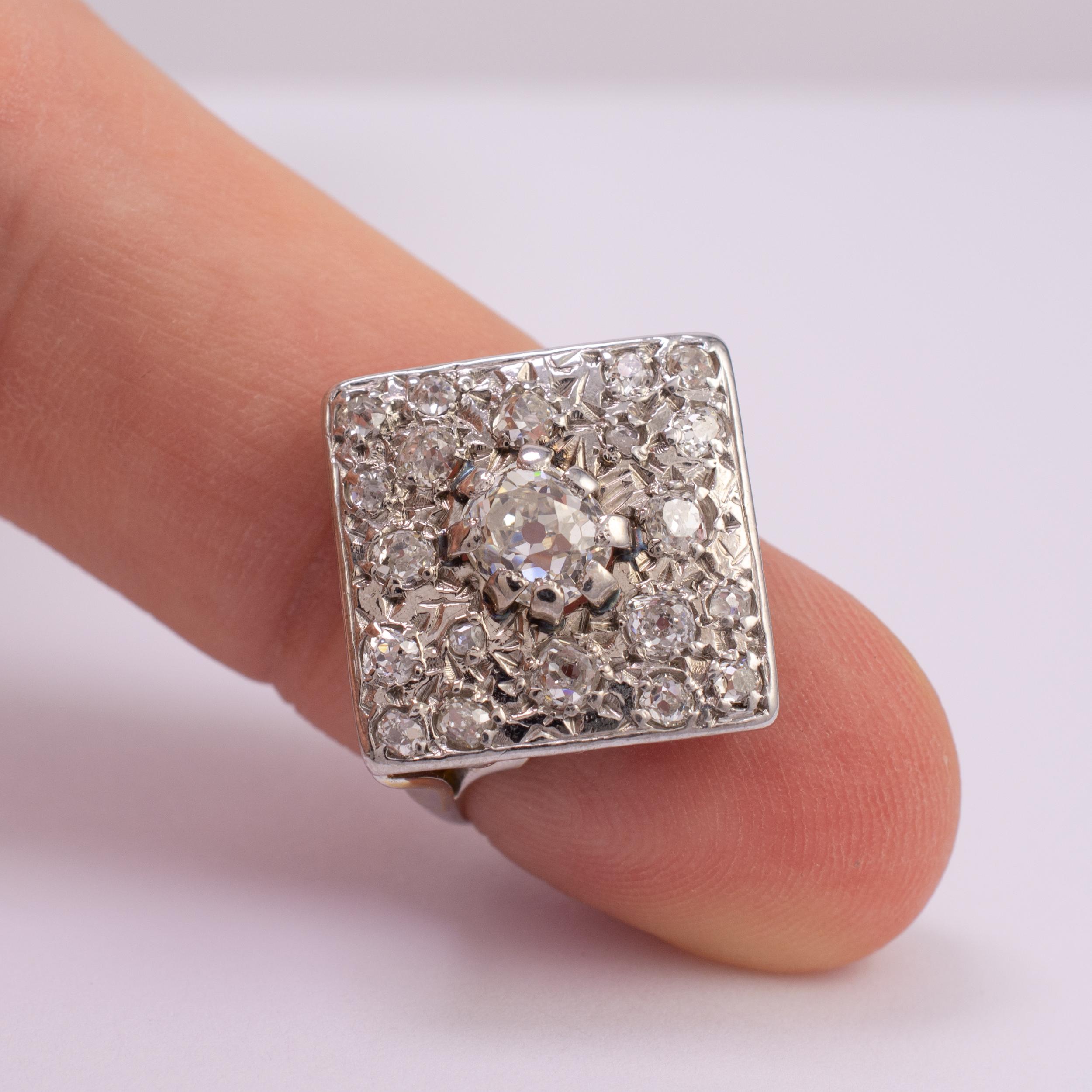 Art Deco statement diamond ring with approx 1.10 carats of old cut diamonds.

The ring features a centrally set old cut diamond of approx. 0.60 carats with twenty various sized accent diamonds arranged into the illusion pressed diamond shape