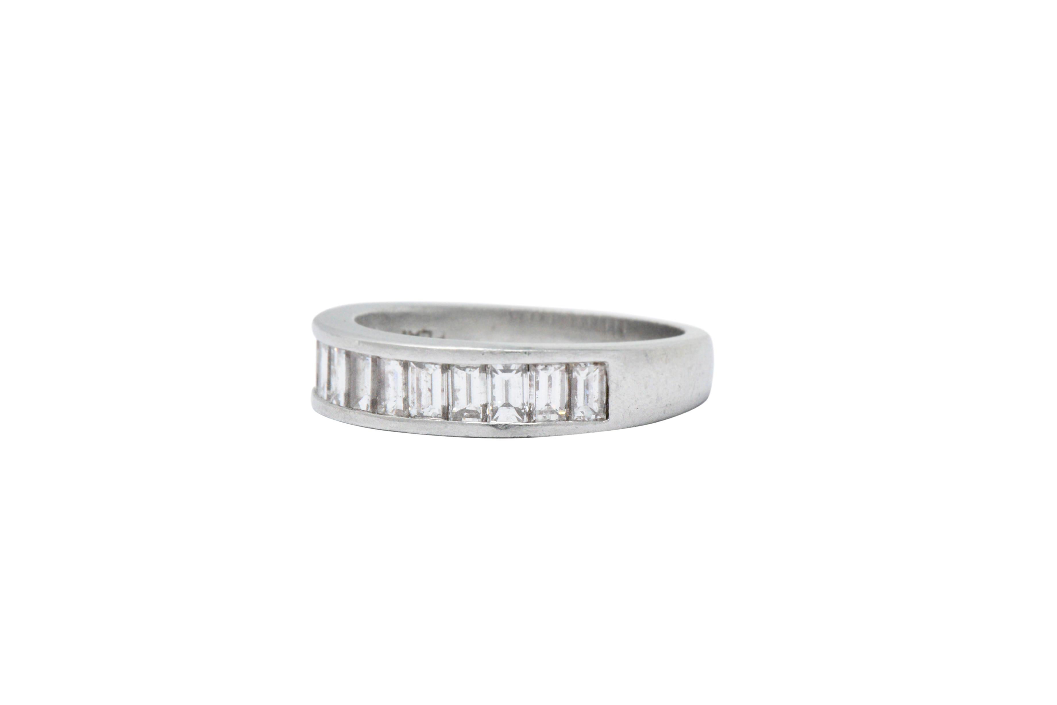 Set to the front with thirteen, channel set, straight baguette cut diamonds, approximately 1.10 carats total, GHI color and VS to SI clarity

The diamonds are well matched and the channel setting gives this ring a sleek refined look, also