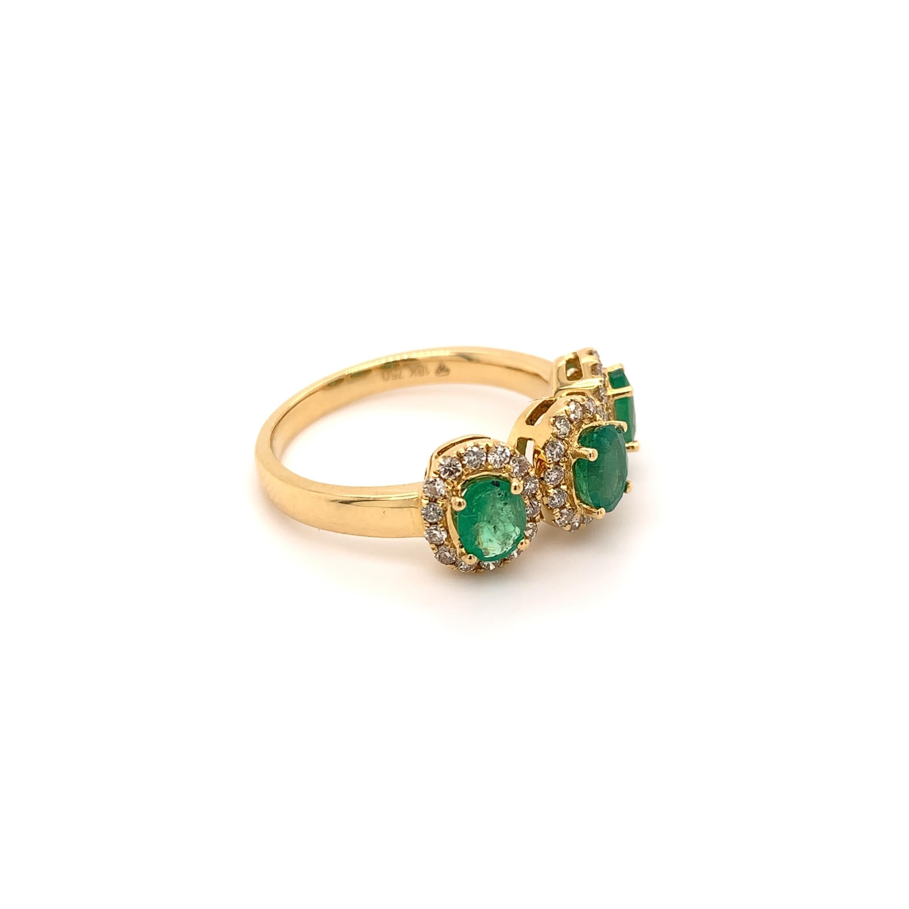 Trinity style emerald diamond ring. High brilliance, lively green, oval faceted 1.10 carats natural emeralds, mounted in high profile open basket with bead prongs, accented with round brilliant cut diamonds. Beautiful handcrafted design set in high
