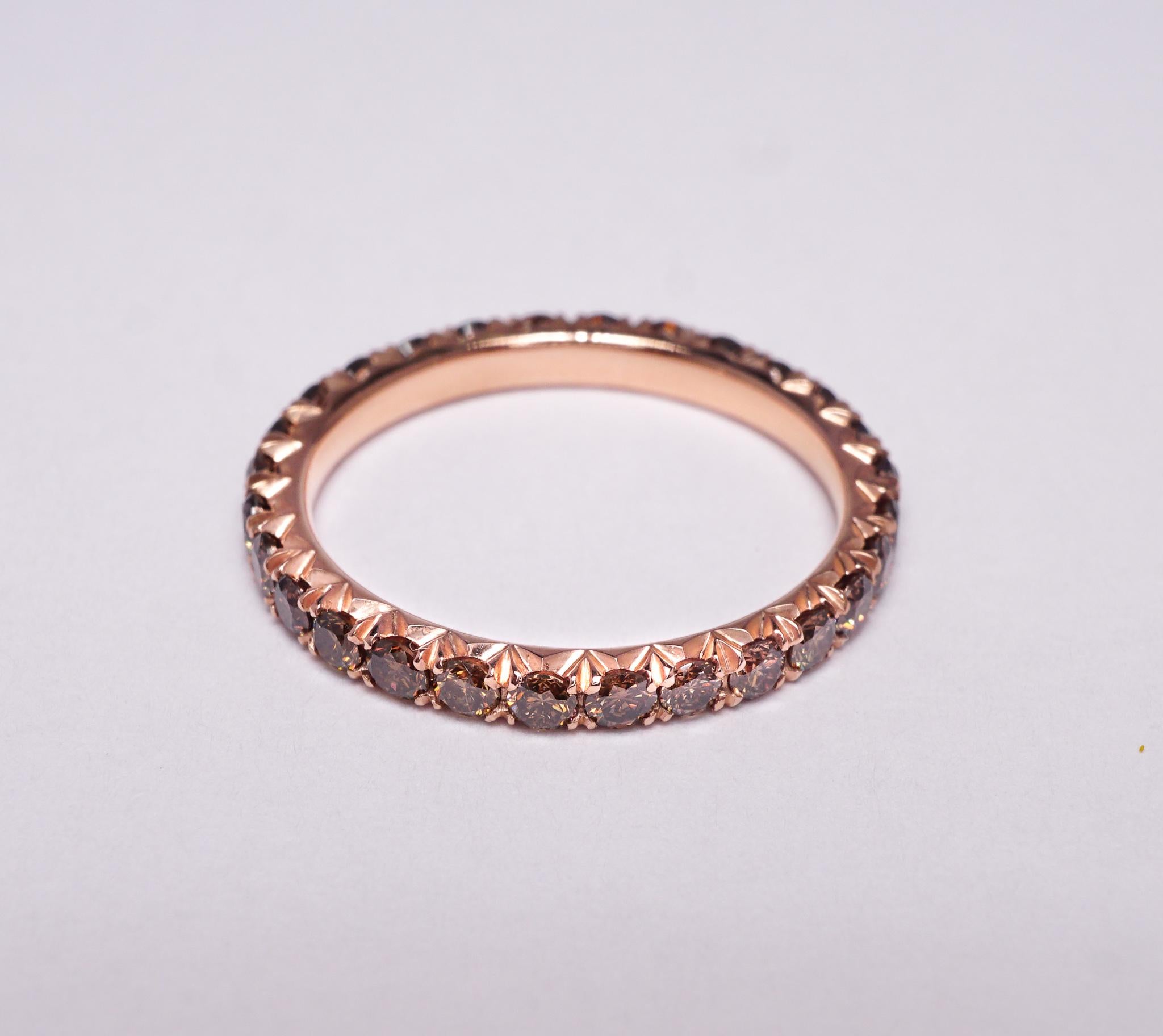 Diamond eternity wedding band set in 14K Rose gold. Pave set Brilliant Round Diamonds are Natural Pinkish-Brown/Orangish-Brown VS1-SI1. Carat weight: 1.10 ct. Total ring weight: 2.30 grams. 
Ring size: 5.75. Can be sized upon request. This ring is