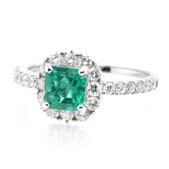 1.10 Carat Natural Colombian Emerald and Diamond Halo Ring set in Platinum