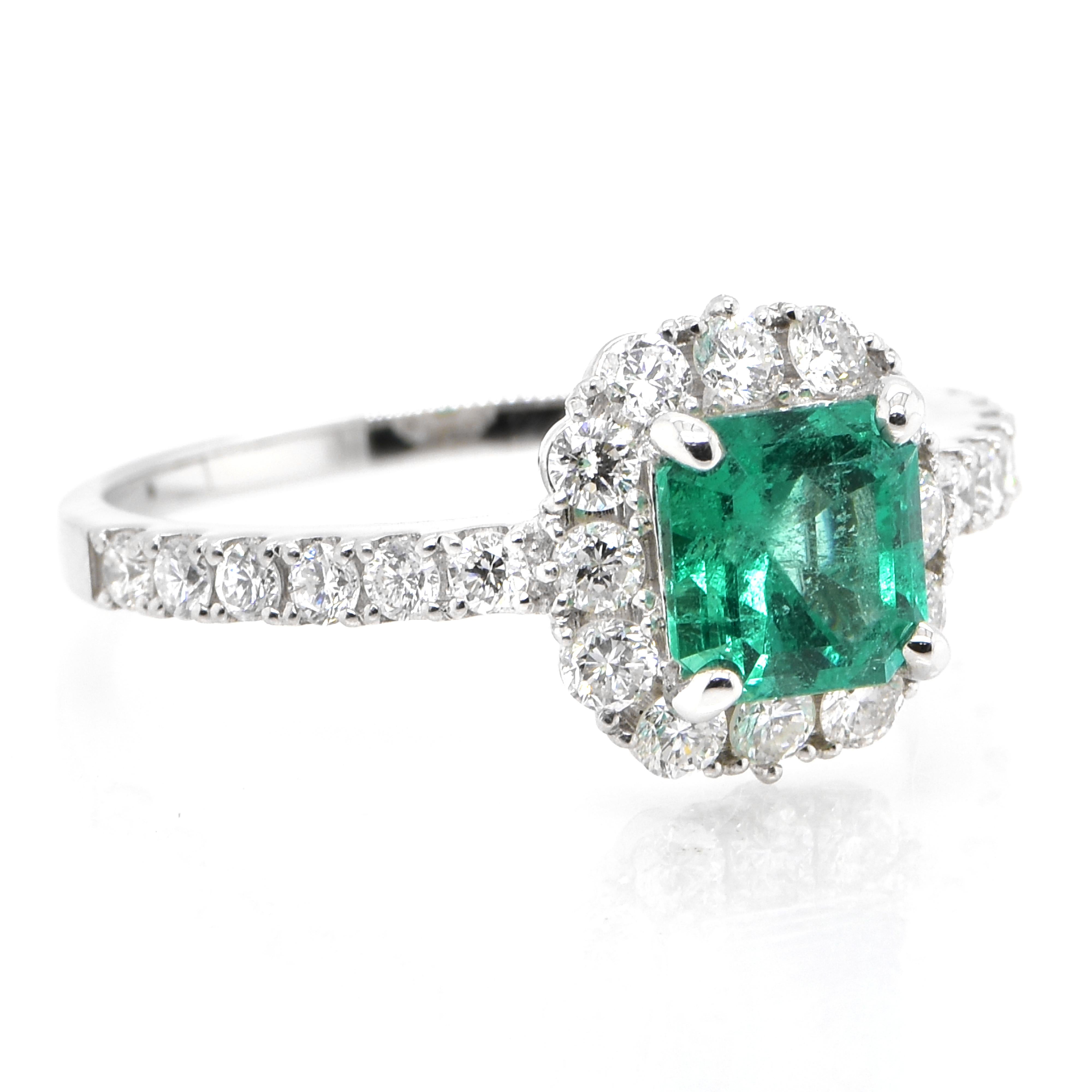 Modern 1.10 Carat Natural Colombian Emerald and Diamond Halo Ring set in Platinum For Sale