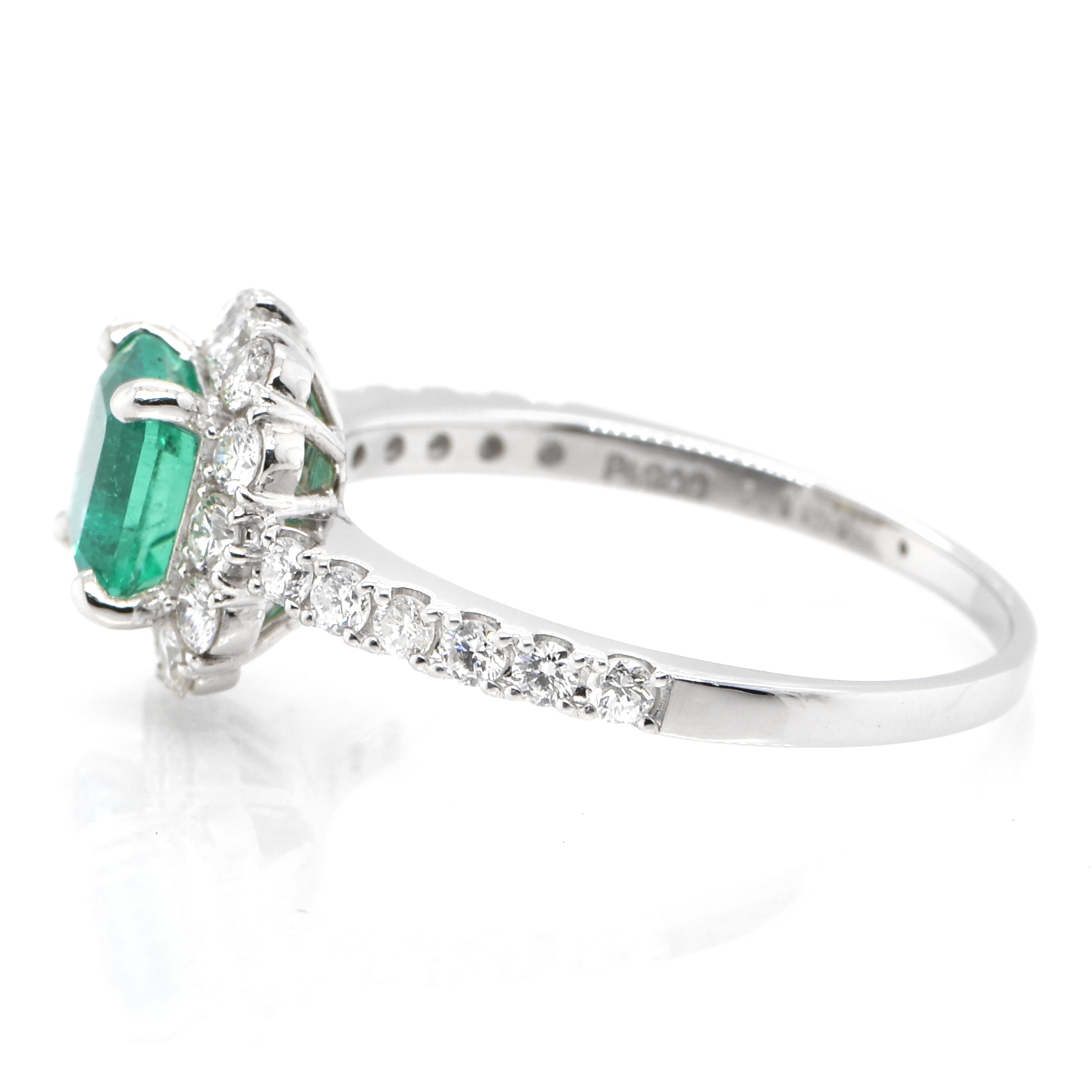 Emerald Cut 1.10 Carat Natural Colombian Emerald and Diamond Halo Ring set in Platinum For Sale