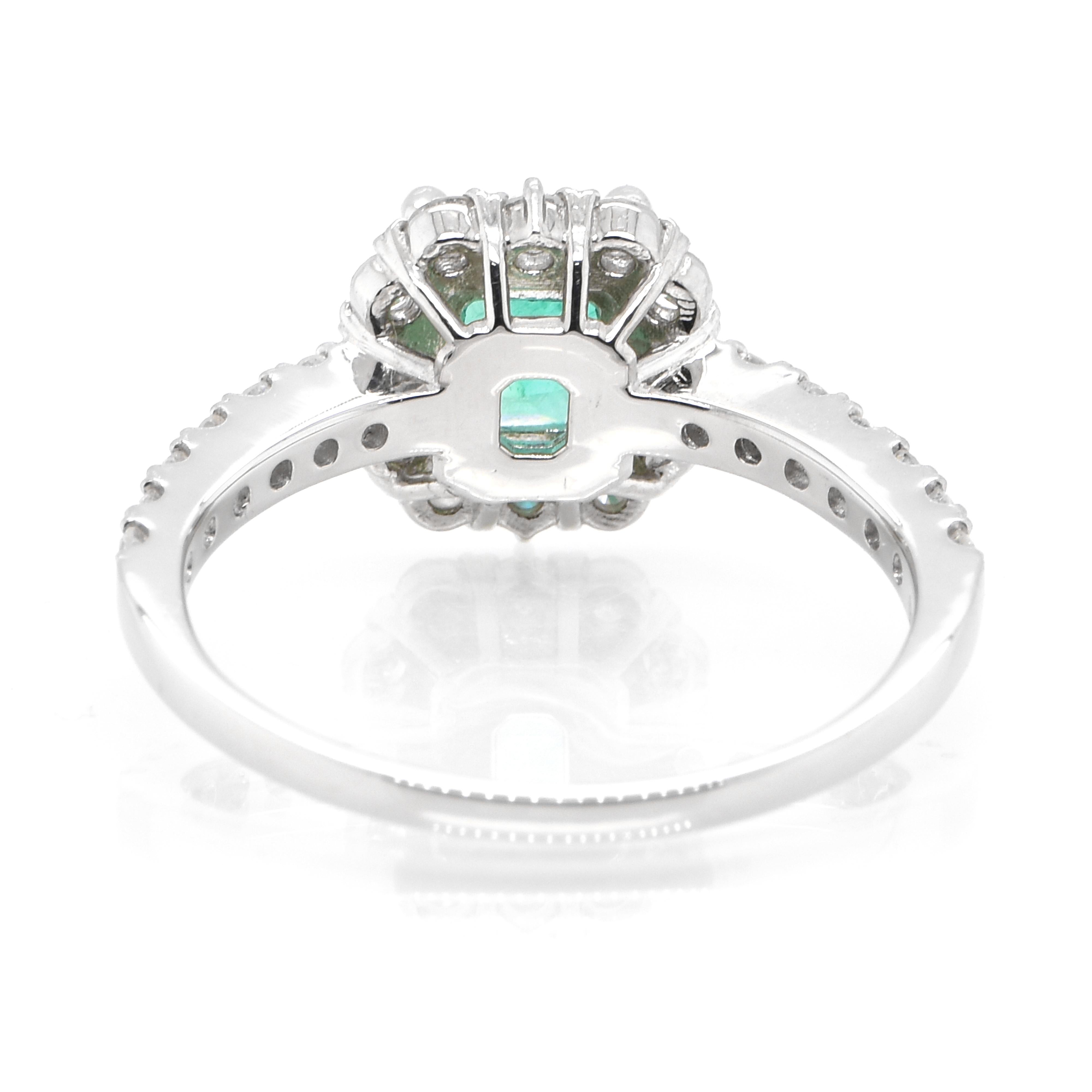 Women's 1.10 Carat Natural Colombian Emerald and Diamond Halo Ring set in Platinum For Sale