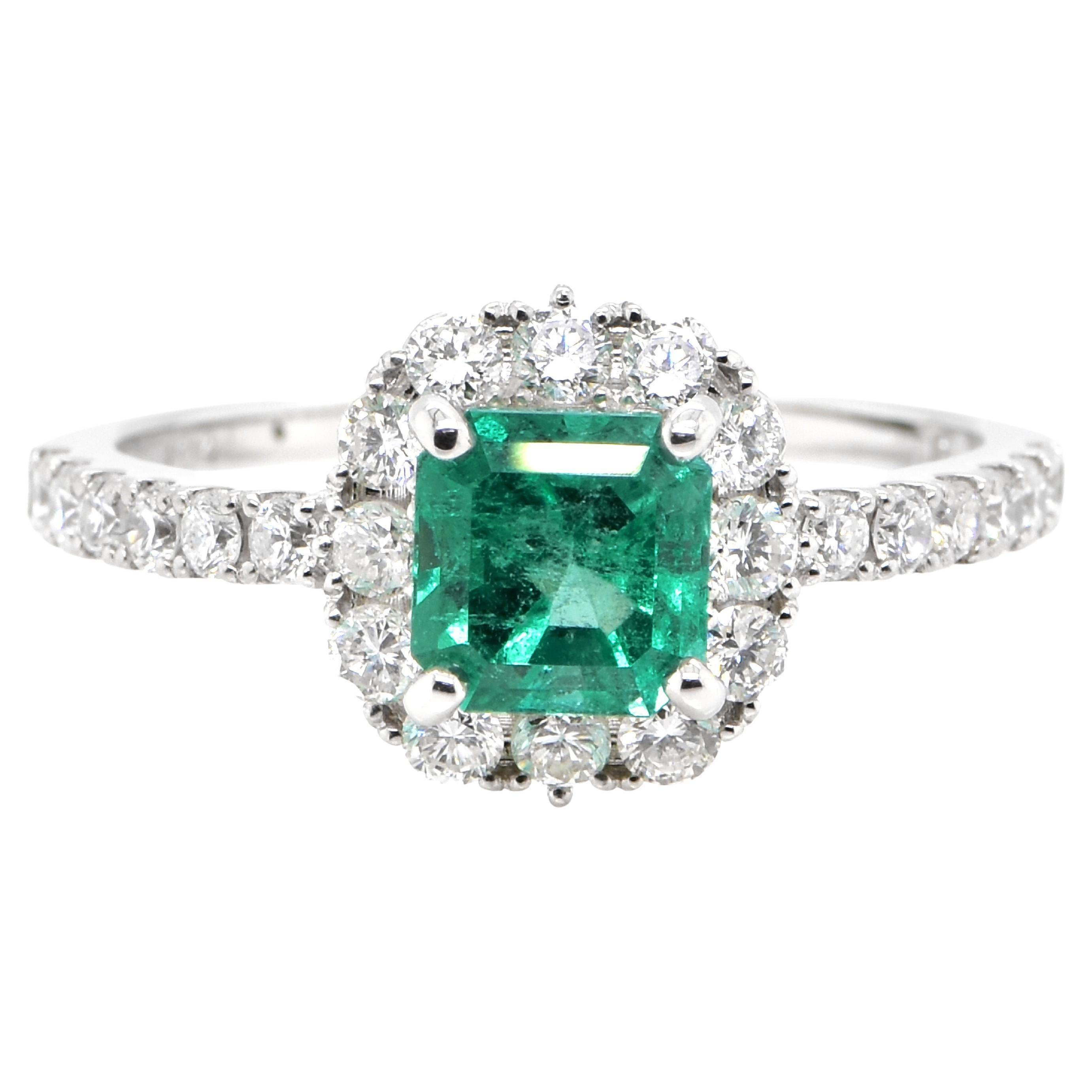 1.10 Carat Natural Colombian Emerald and Diamond Halo Ring set in Platinum For Sale
