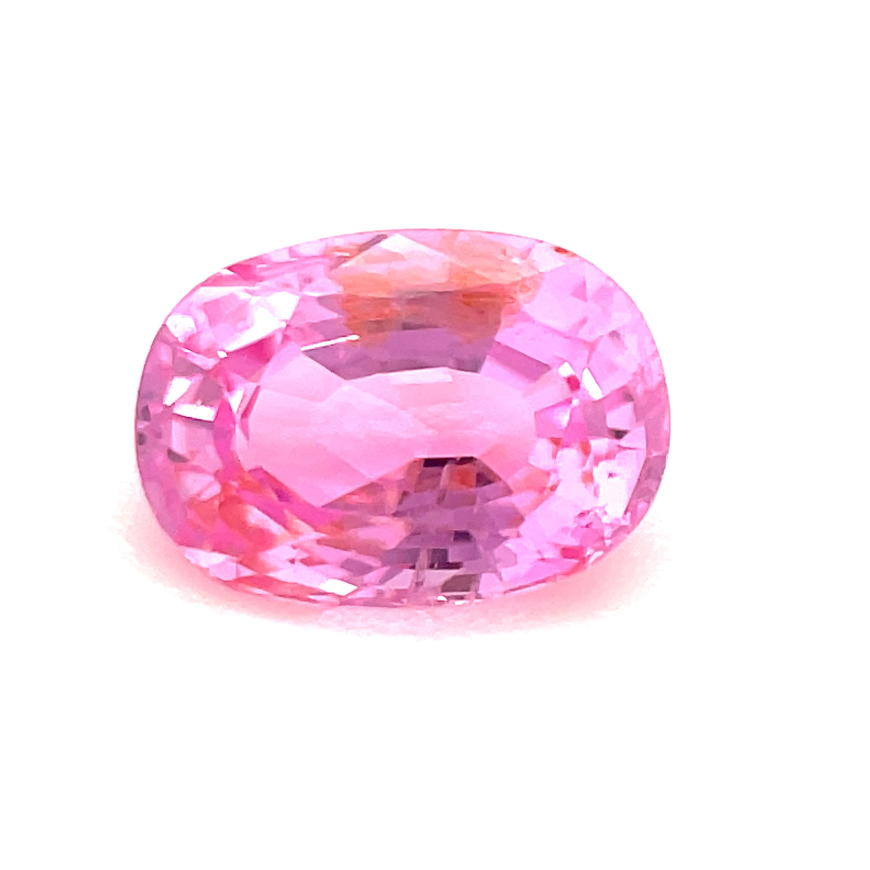 This sparkling bubblegum pink sapphire has rich color that will make a stunning ring or pendant! Measuring 6.93 x 4.94 millimeters, it has both beautifully bright pink color and an elegant shape. This gem is eye clean with wonderful life and salmon