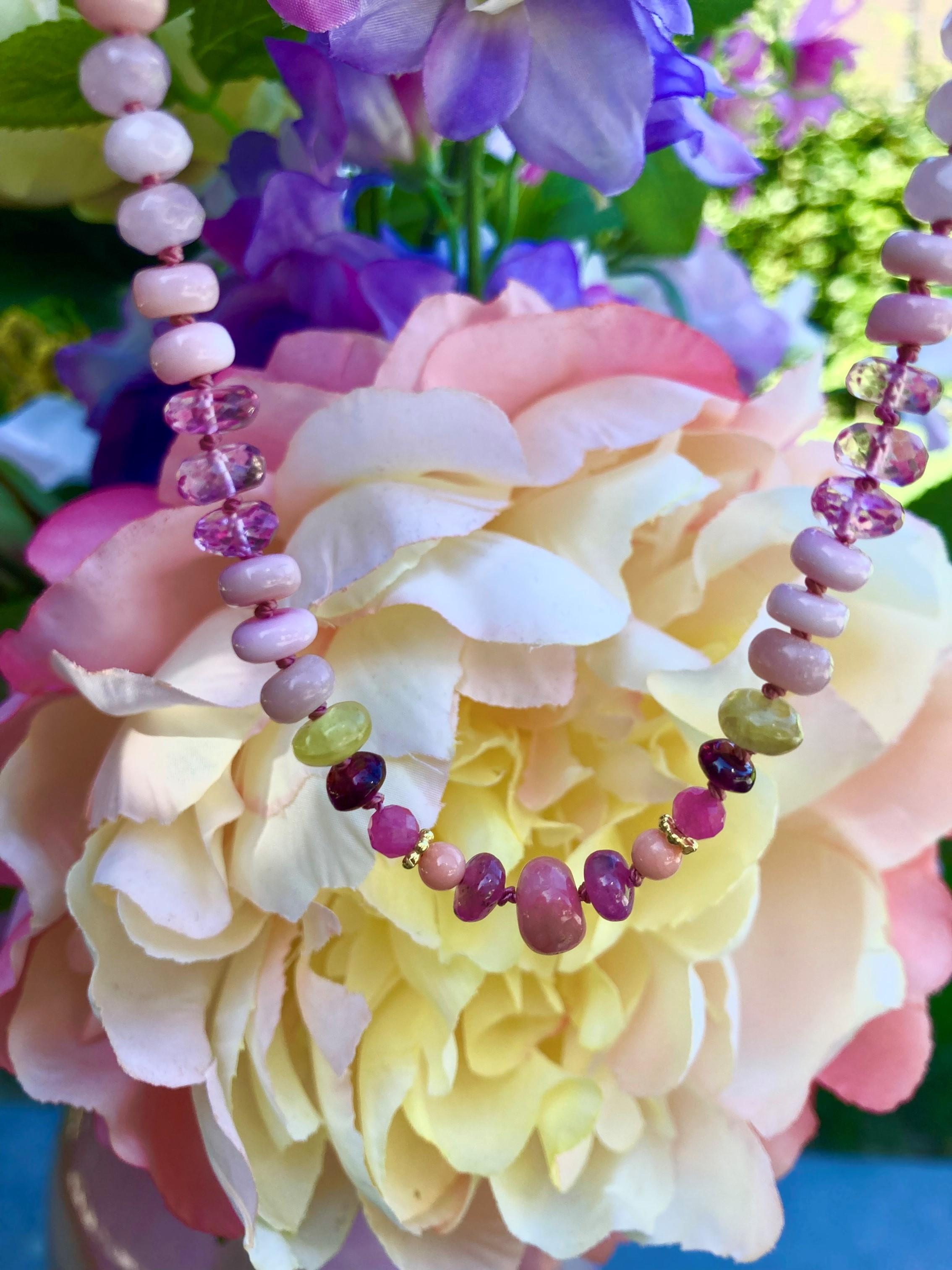 A stunning statement necklace with blush pink Australian and Peruvian opals that glint with bright 14k solid gold beads and clasp. Each gemstone is methiciously handknotted and follow a beautifull feminine pink pattern. The gemstones included