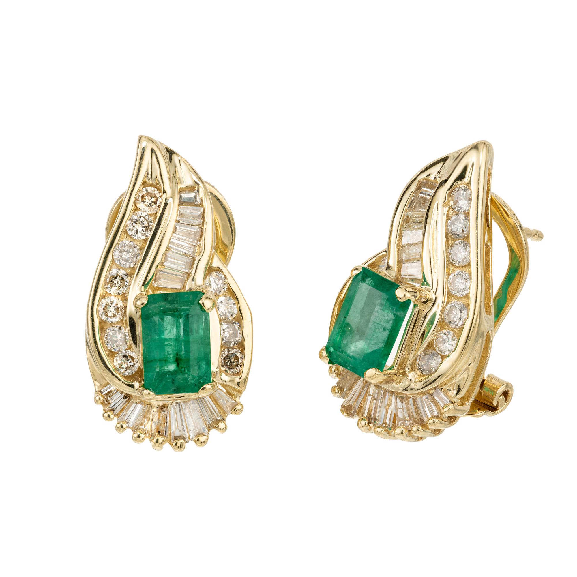 Discover the 1960's pinnacle of elegance with these rectangle emerald and diamond halo clip post 14k yellow gold earrings. Each earring flaunts a stunning rectangle emerald with a combined carat weight of 1.10cts. beautifully cradled by a shimmering