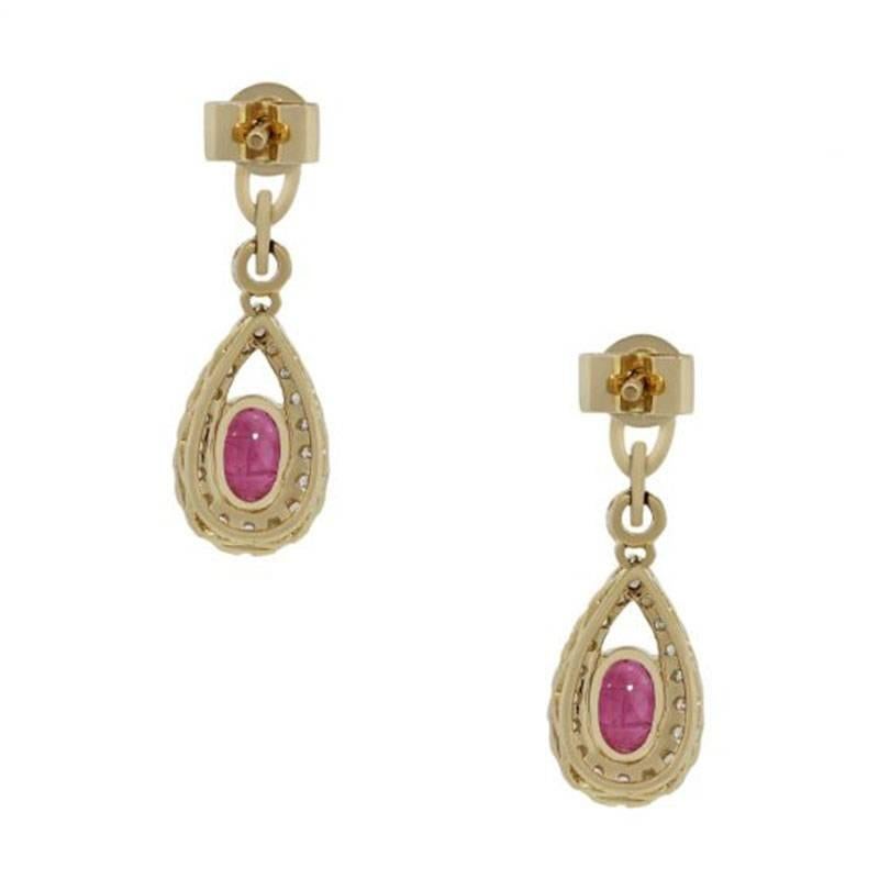 Style: Ruby diamond dangle earrings
Material: 14k Yellow Gold
Gemstone Details: Approximately 1.10ctw ruby gemstones
Diamond Details: Approximately 0.27ctw of Round brilliant diamonds, diamonds are G/H in color and SI in clarity.
Earring