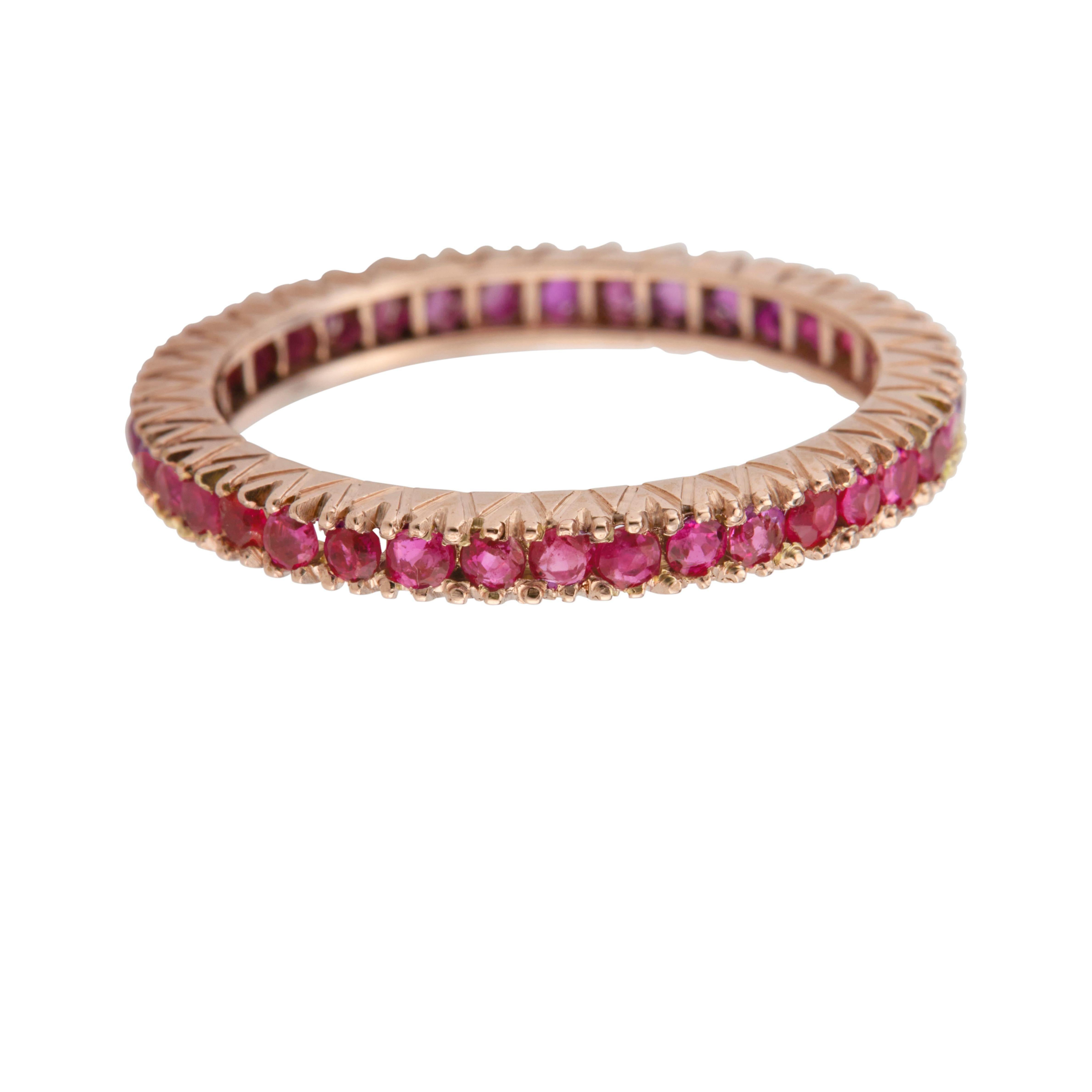 Retro ruby eternity wedding band ring with 40 round pink red natural rubies set in 14k rose gold. 

Approx. 40 round pinkish red genuine natural Rubies, approx. total weight 1.10cts, SI, 1.5mm
Size 7.75 and sizable
14k rose gold
2.3 grams
Tested: