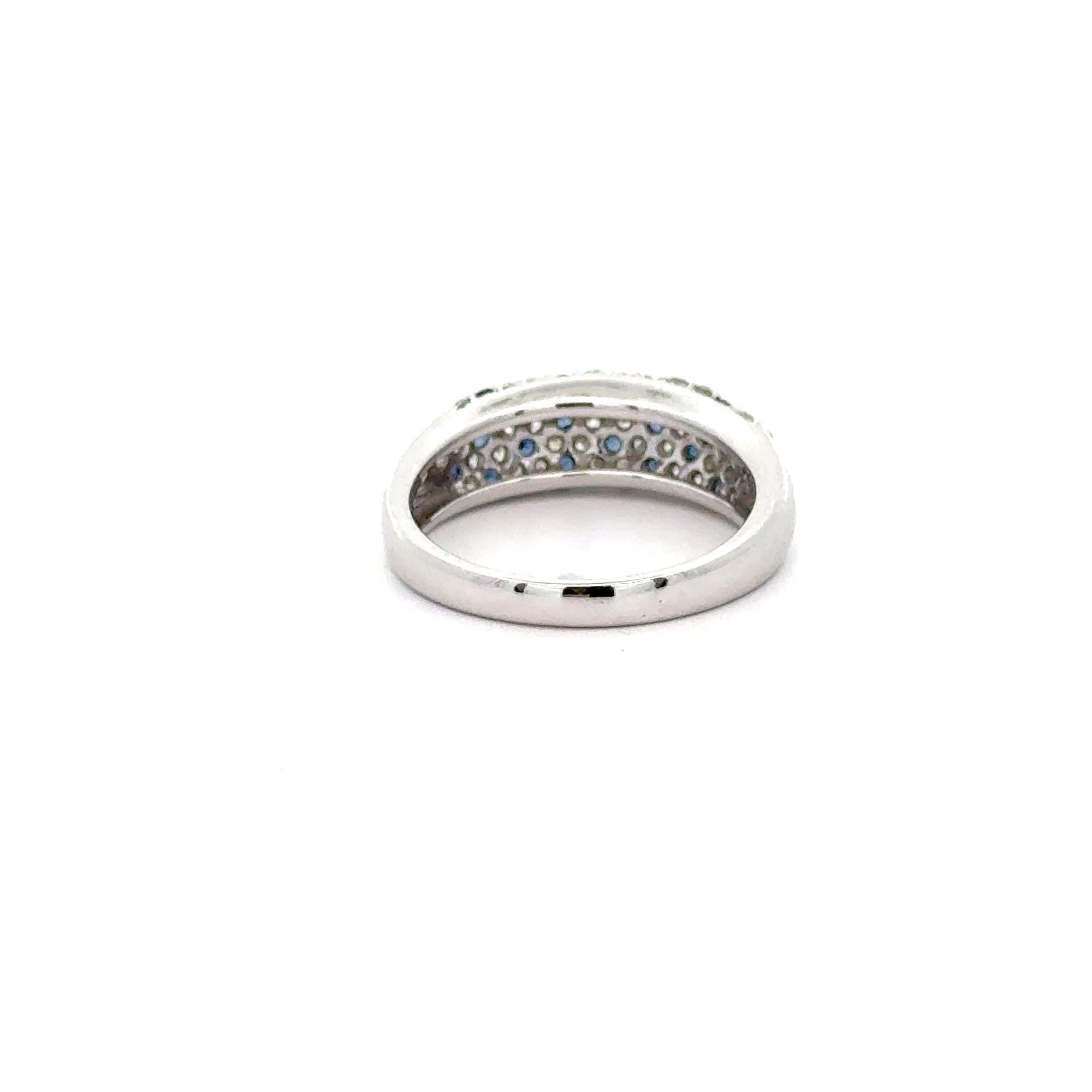 Platinum 900 set pave blue sapphire and diamond band ring. Offering a minimalist dome shape of brilliance in round cut natural gemstones. 

Details:
Item Type: Dome Band Ring
Metal: Platinum 900
Size: 7 (adjustable)
Weight: 6.88 Grams

Center Stone