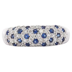 Anillo de platino con zafiro y diamantes de 1,10 quilates en racimo pavé