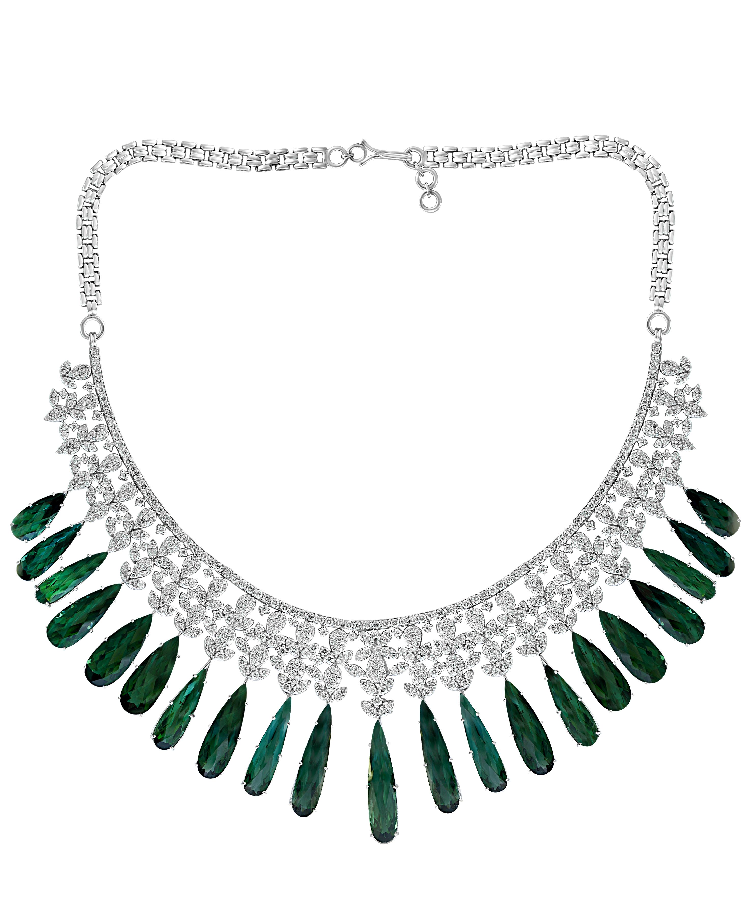 110 Carat Tear Drop Green Tourmaline & 25 Ct Diamond Necklace Suite 18 Karat white   Gold
This extraordinary Necklace is consist  of  Fine long Tear Drop natural  Green Tourmaline  weighing approximately 110 Carat with diamonds.
  There are  total 