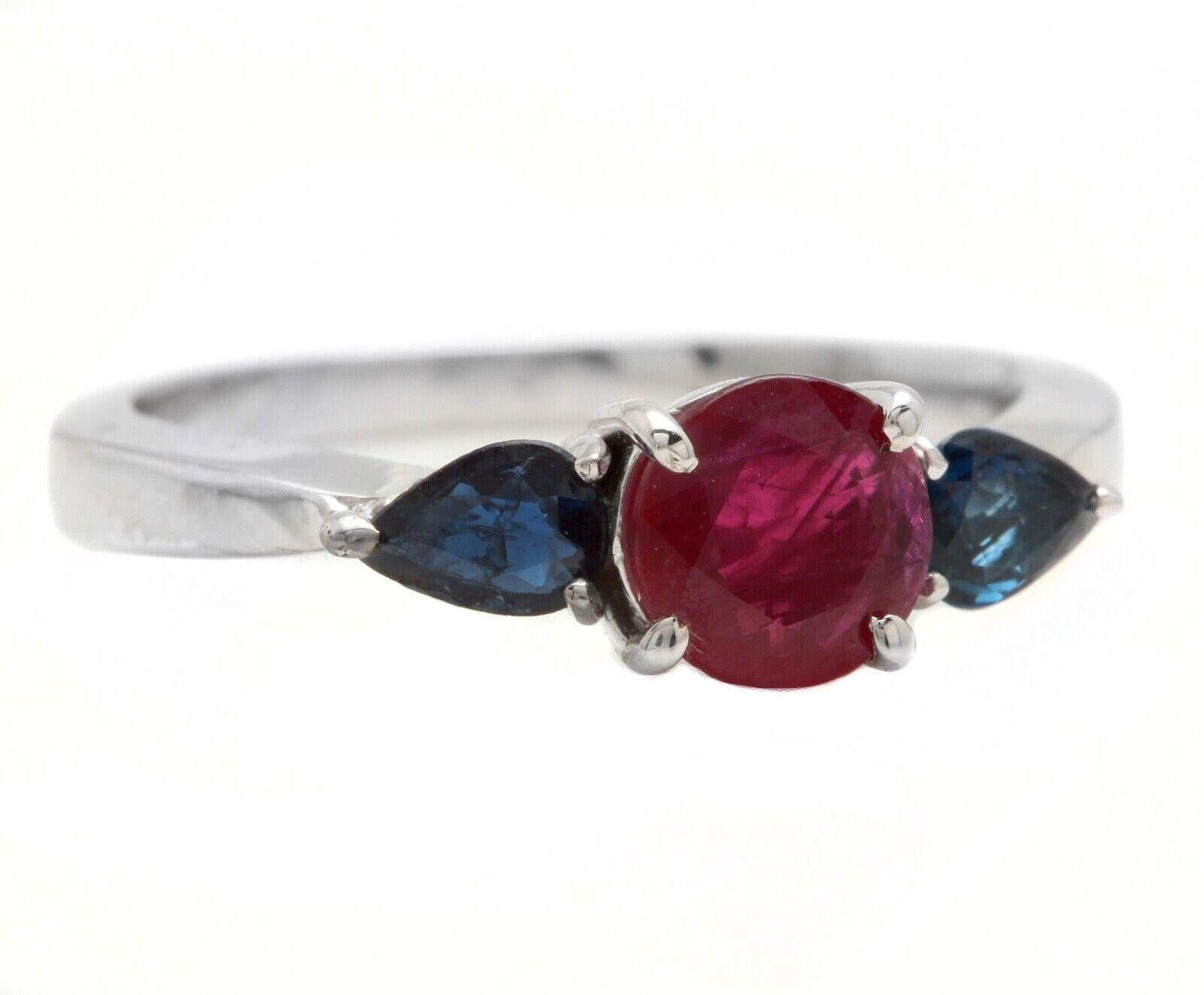 1.10 Carats Exquisite Natural Ruby & Sapphire 14K Solid White Gold Ring

Total Natural Round Ruby & Pear Shaped Sapphire Weight is: Approx. 1.10 Carats 

Ruby Measures: 5.40mm

Ruby & Sapphires Treatment: Heating

Ring size: 4.75 ( Free sizing