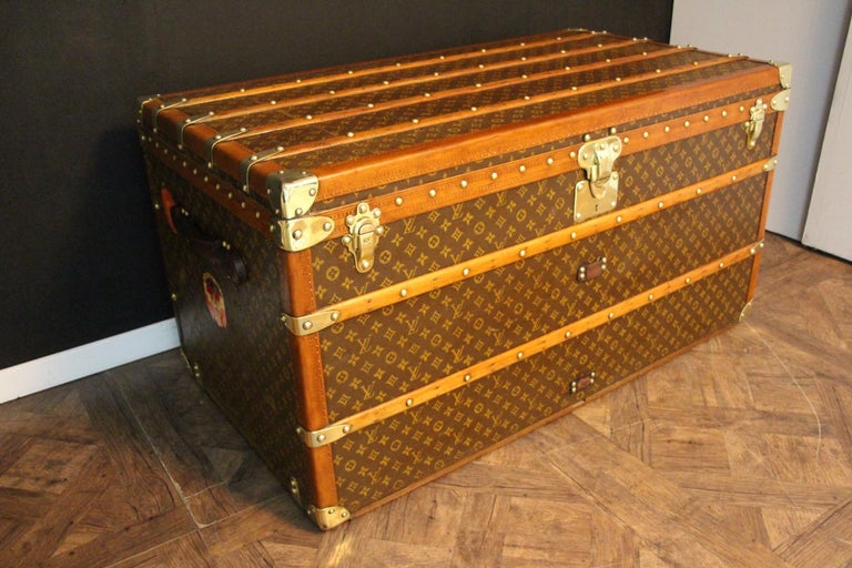 Sold at Auction: LOUIS VUITTON STEAMER TRUNK Exterior with allover LV  monogram, beechwood slats, brass locks and hardware, and original casters.  One