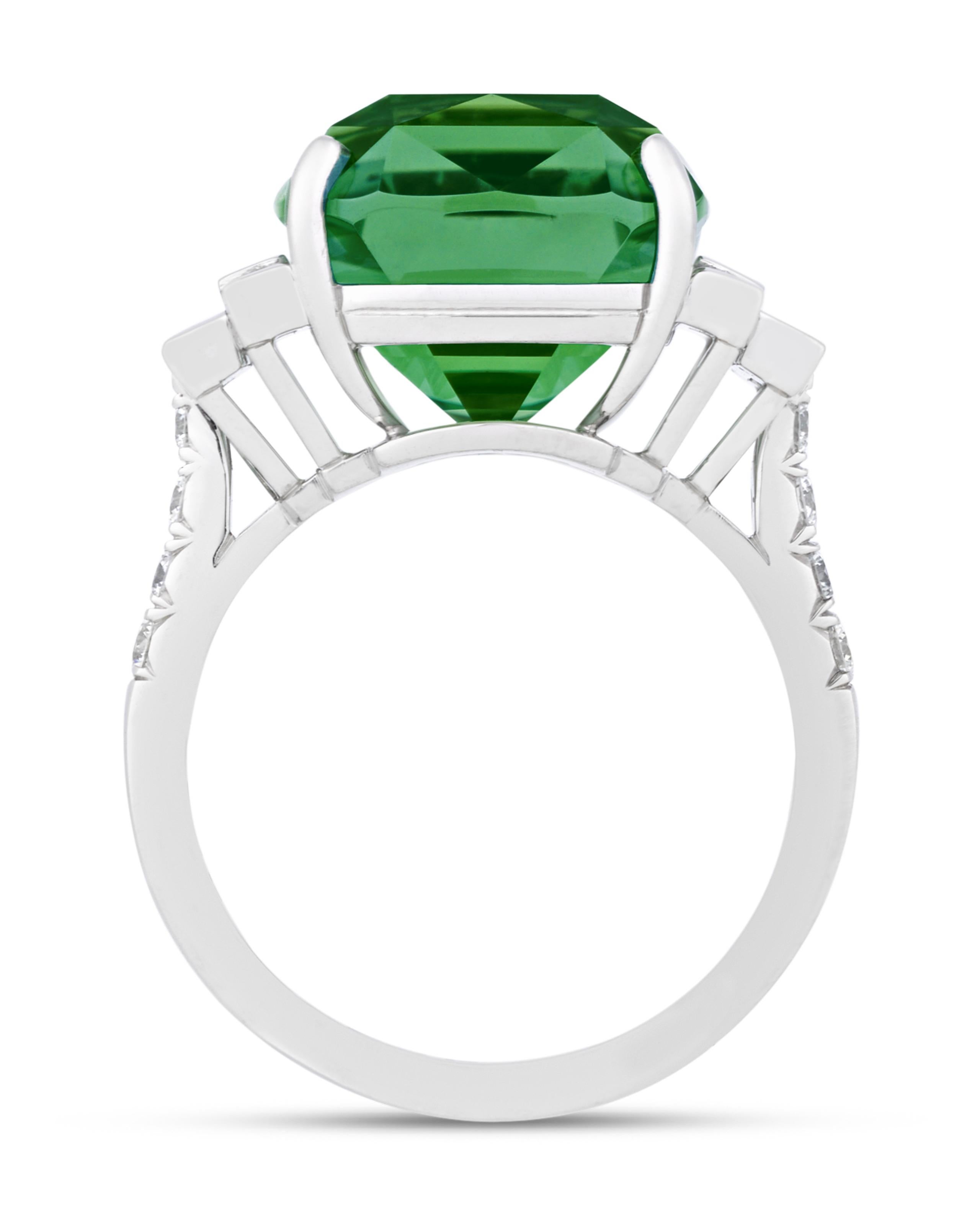 Certified as possessing a very good quality grade and a deep green hue, a natural mint tourmaline serves as the focal point of this platinum ring. The cushion-cut gem is joined by twelve baguette and round diamonds for a total of 1.07 carats.

M.S.
