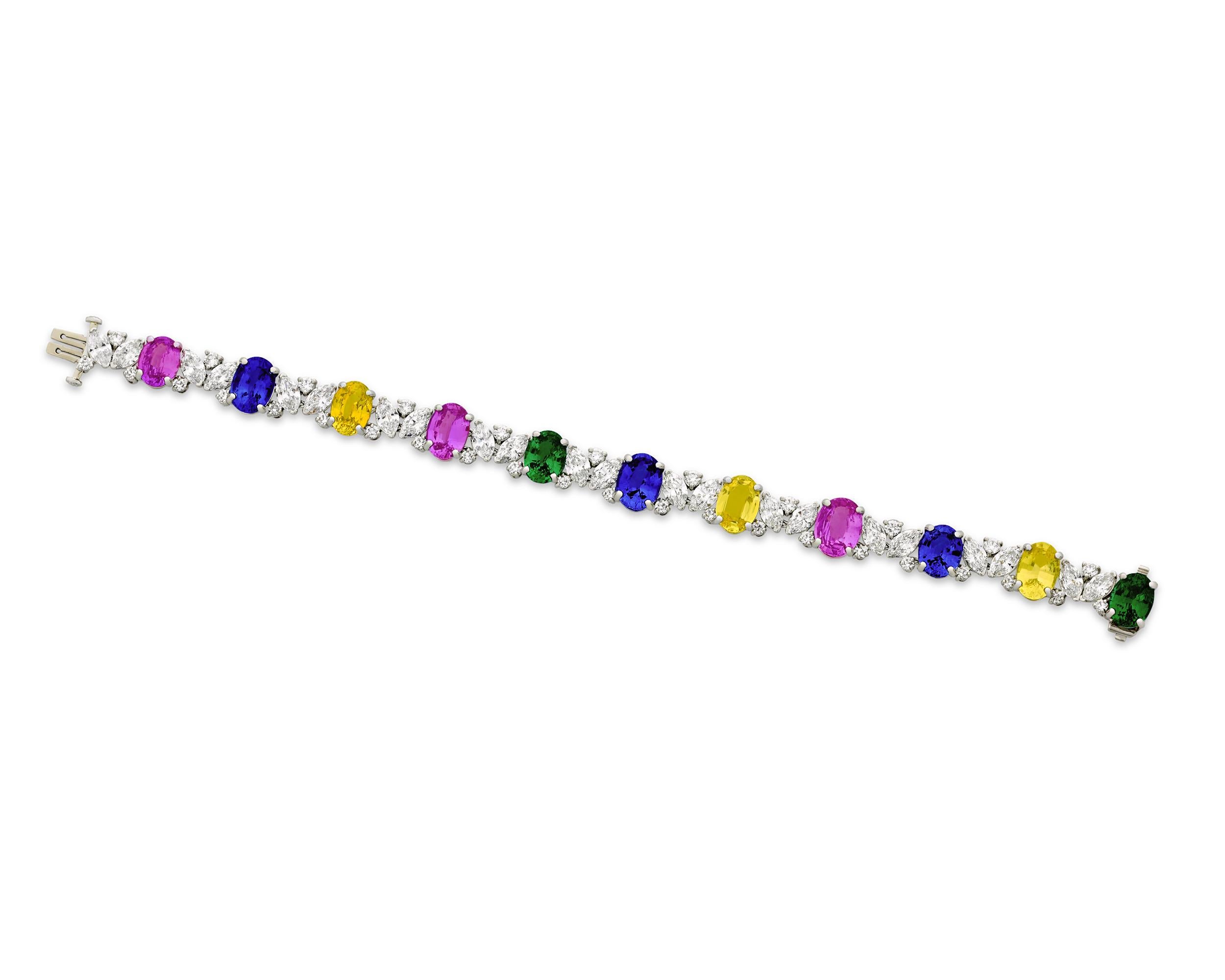 Sapphires and tsavorites ranging in color from blue to pink, purple and yellow present a sparkling rainbow of hues in this statement bracelet. With over 20.00 carats of sapphires and nearly 5.00 carats of tsavorites, the exquisite craftsmanship