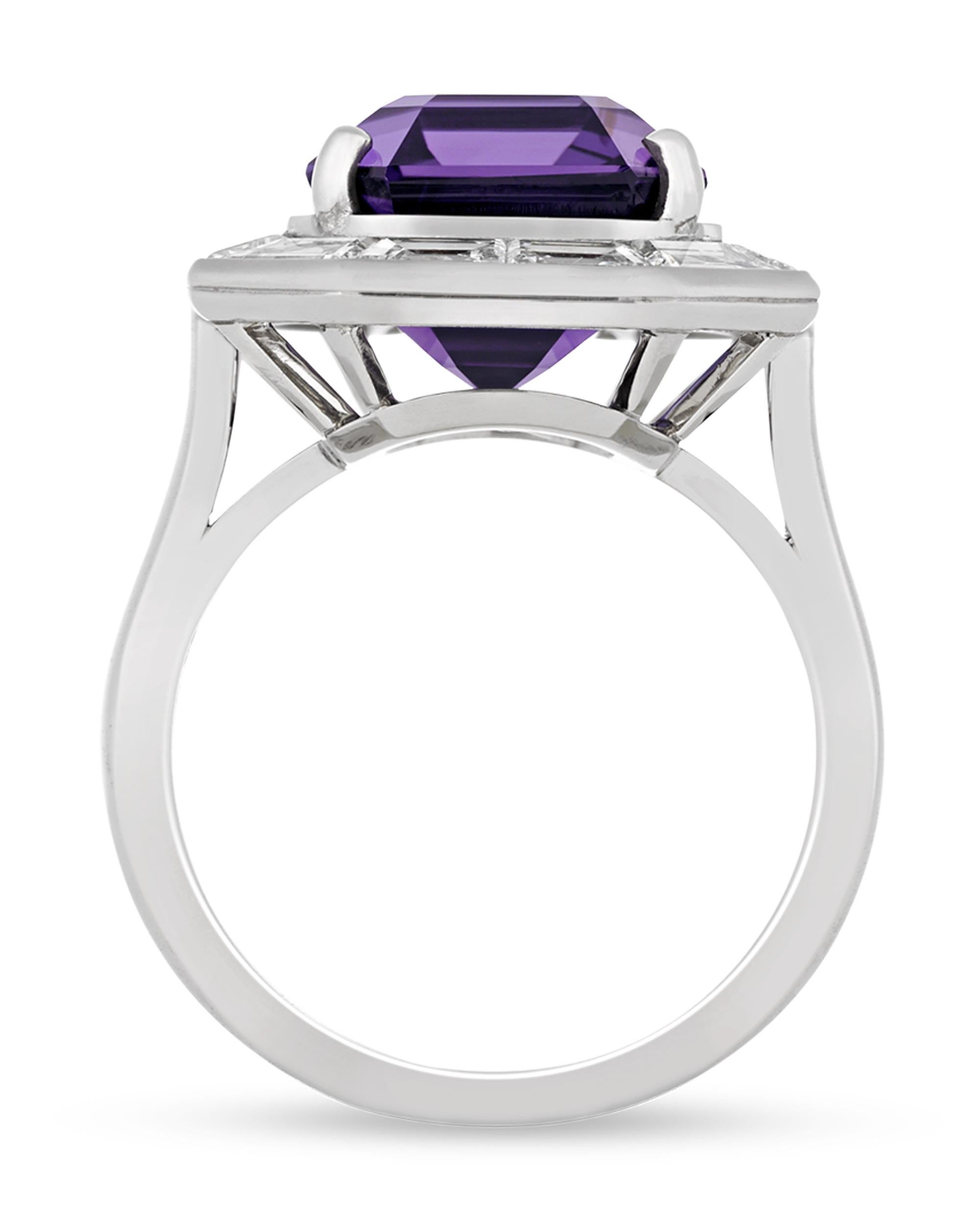 A 10.86-carat fancy purple sapphire displays its extraordinary hue at the center of this octagonal ring. Purple sapphires stand among the most sought-after colored gemstones and are highly treasured among gem collectors, and this example is