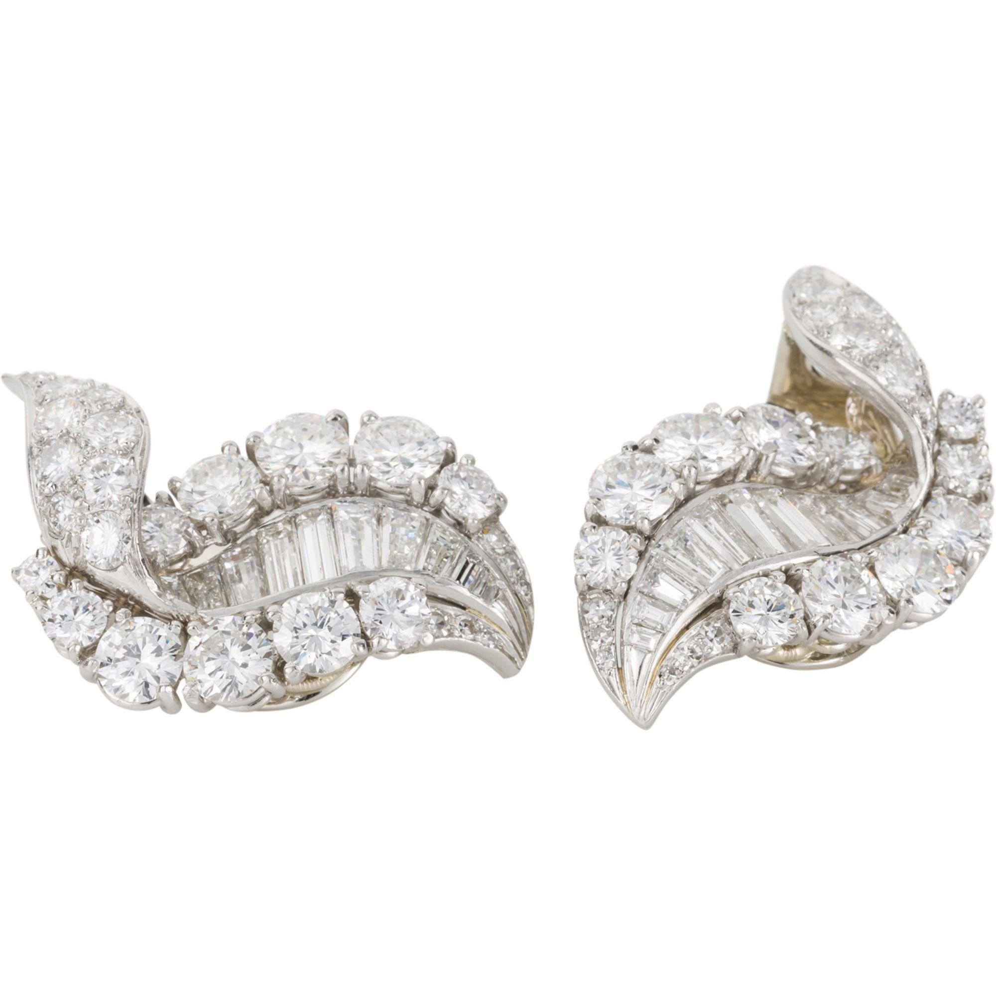 Magnificent is the only way to describe these earrings showcasing beautiful top quality diamonds. A mixture of round brilliant cuts and baguette cut diamonds - 11cts in total. Each set with 11 baguette cuts and 26 round brilliant cuts a total of 74