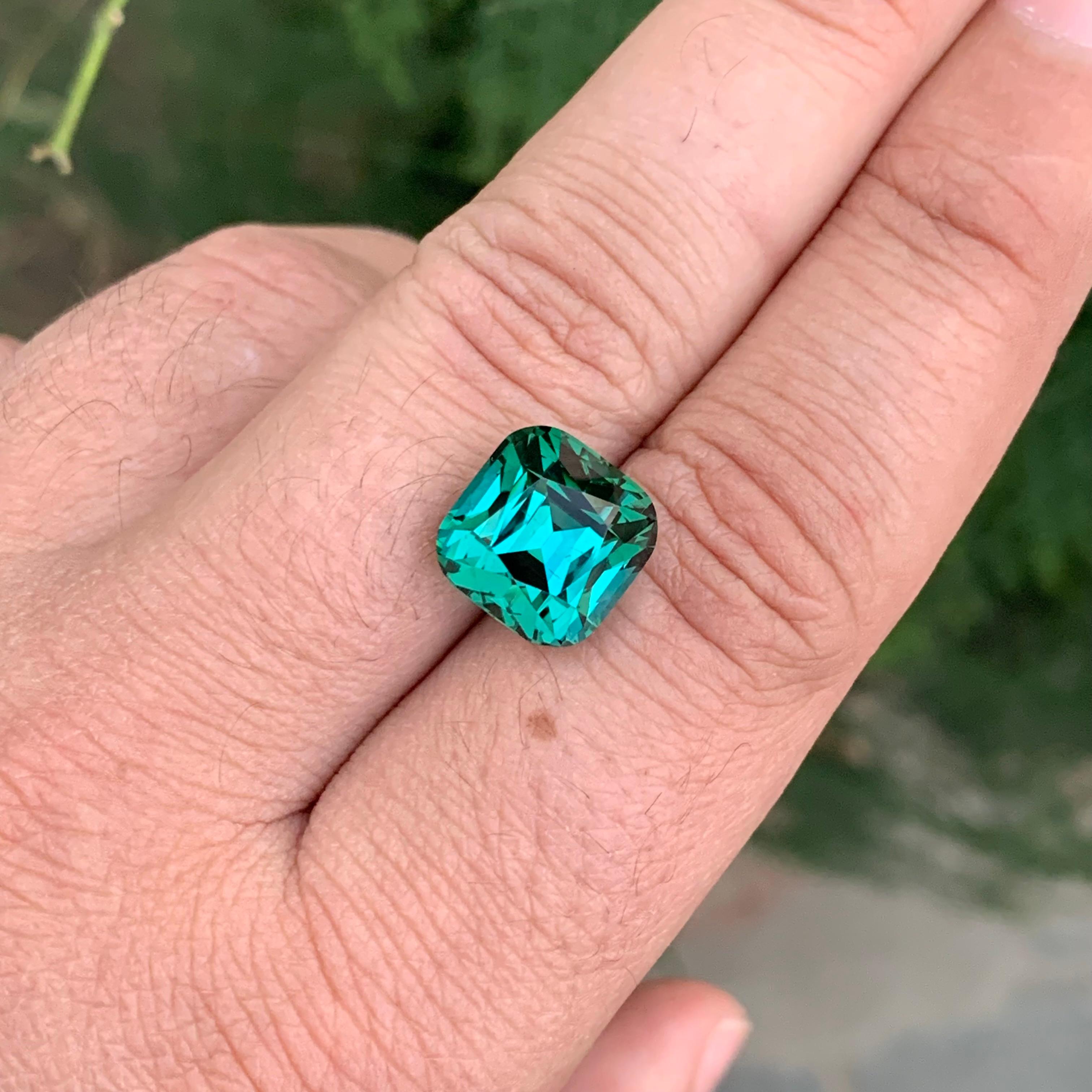 Faceted Green Blue Tourmaline

Weight: 11.00 Carat
Dimension: 11.6 x 11.3 x 10.5 Mm
Colour: Green Blue 
Treatment: Non
Certificate: On Customer Demand
Shape: Cushion 
Clarity: Loupe Clean 


Tourmaline is a captivating gemstone known for its