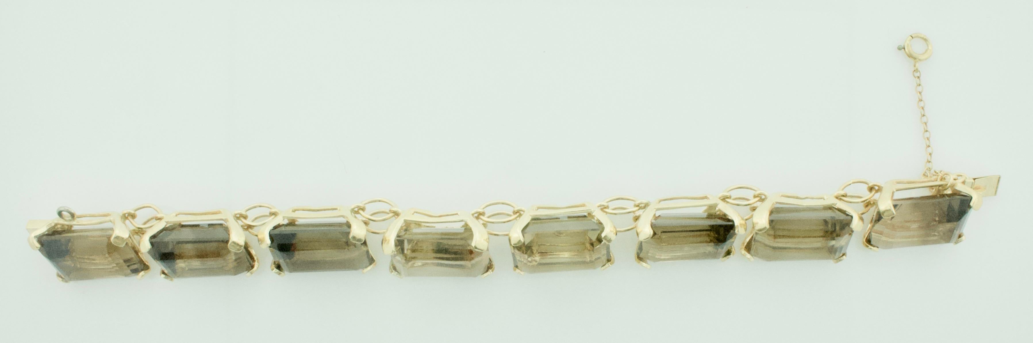 Emerald Cut 110.00 Carats Smokey Quartz Tennis Bracelet in Yellow Gold For Sale