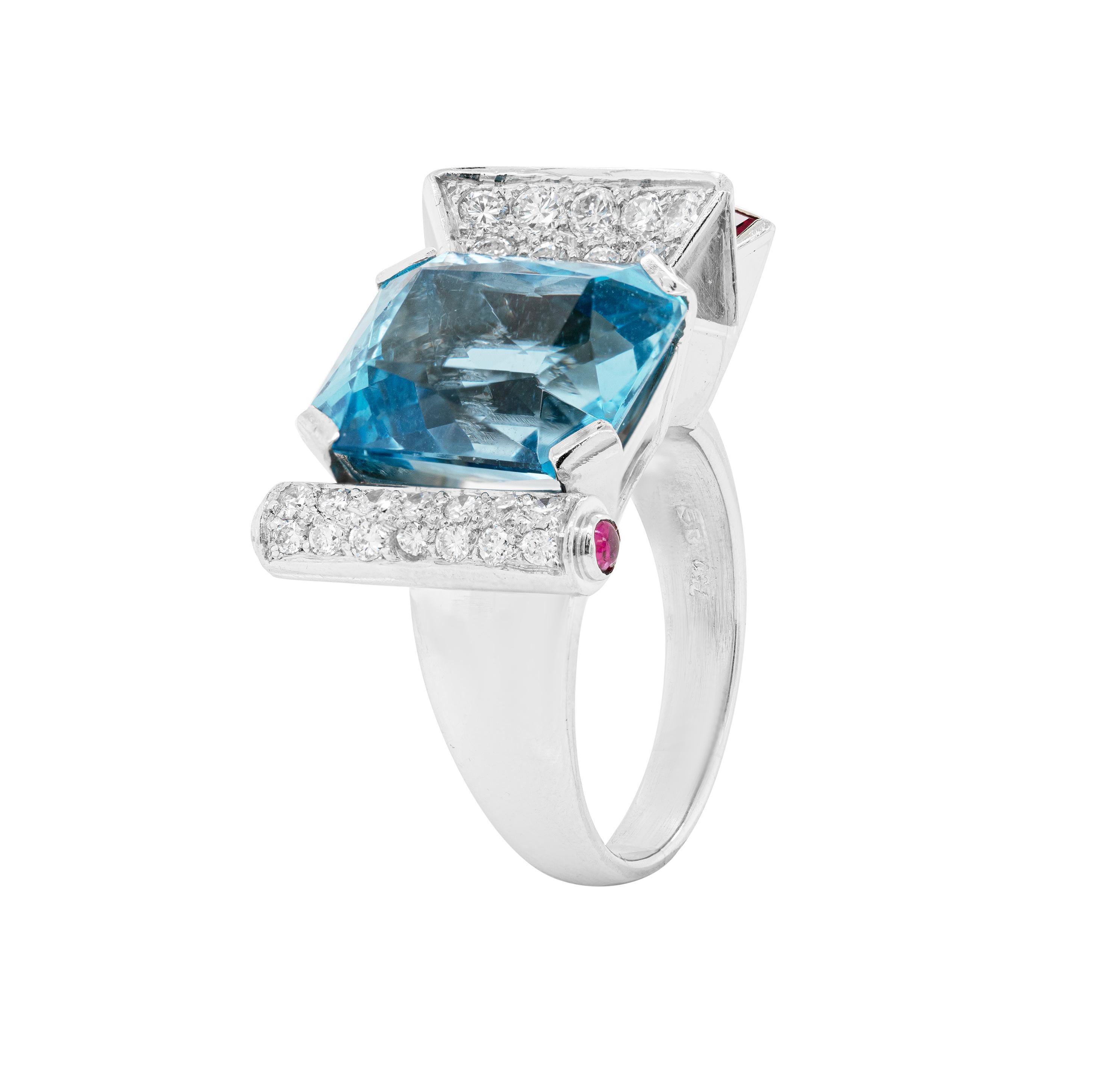This one of a kind vintage cocktail ring features an intricate architectural design crafted from 18 carat white gold. An impressive 11.00ct square cushion cut aquamarine, mounted in a four claw, open back setting, beautifully centres the spectacular