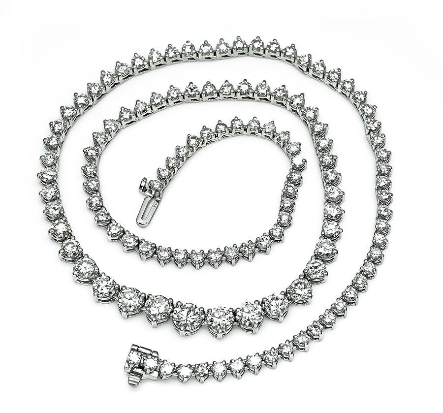 This is a gorgeous 14k white gold tennis necklace. The necklace is set with sparkling round cut diamonds that weigh approximately 11.00ct. The color of these diamonds is H-I with VS2-SI1 clarity. The necklace has a tapering width from 3mm to 6mm.