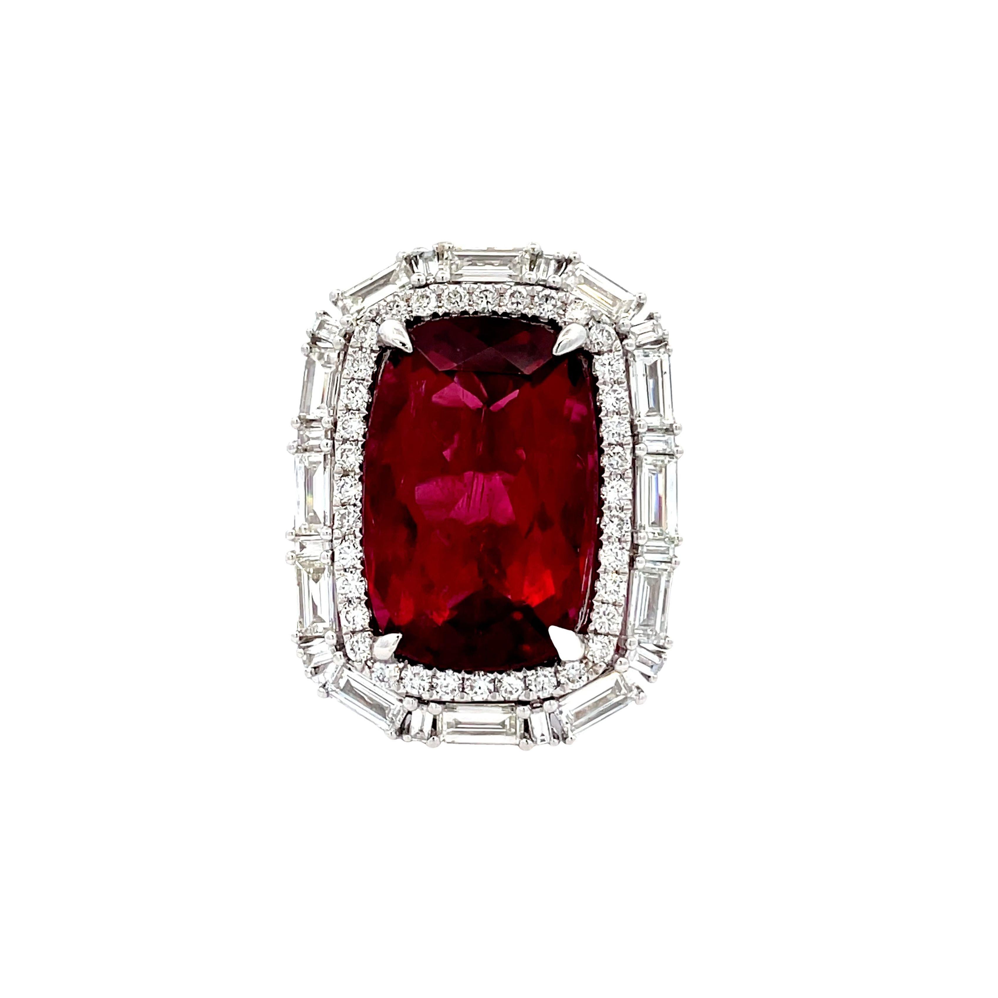 Indulge in luxury with our size 7 18KW Ring, showcasing a stunning 11.01 CT cushion-cut red tourmaline, perfectly complemented by 1.75 CT of mixed-shape white diamonds, creating an exquisite statement piece of timeless elegance.