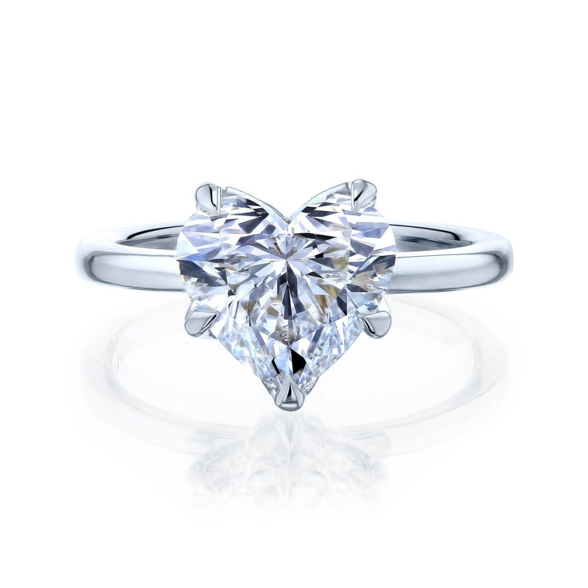 This breathtaking 11.03-carat heart-shaped diamond ring is a timeless symbol of love and sophistication. The centerpiece of this masterpiece is a GIA-certified diamond, graded E for color, ensuring near-colorless brilliance with a captivating