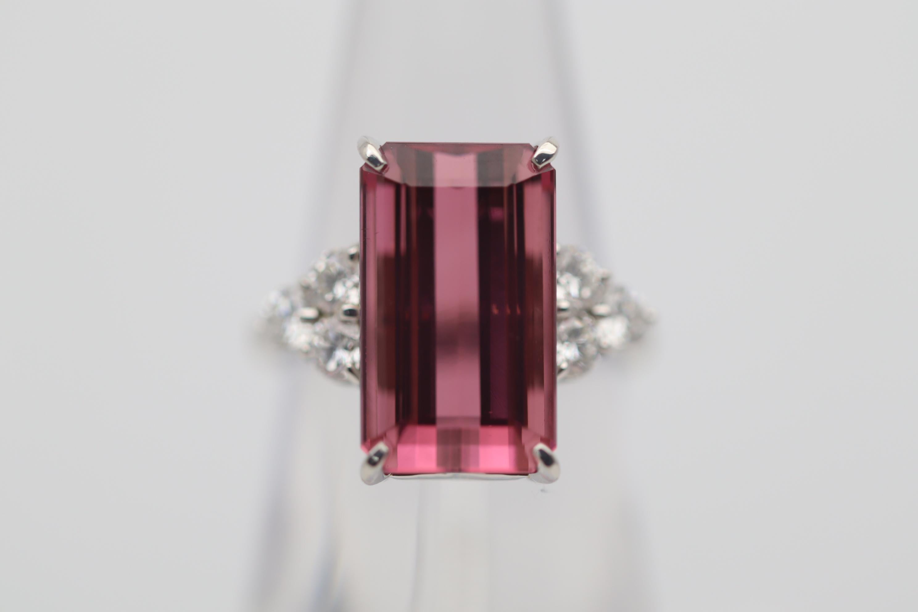 A fine and luscious tourmaline takes center stage. It weighs an impressive 11.05 carats and has bright juicy pink color that is so pleasing to the eye. Adding to that, it has a long rectangular shape and is loup clean meaning no inclusions can be