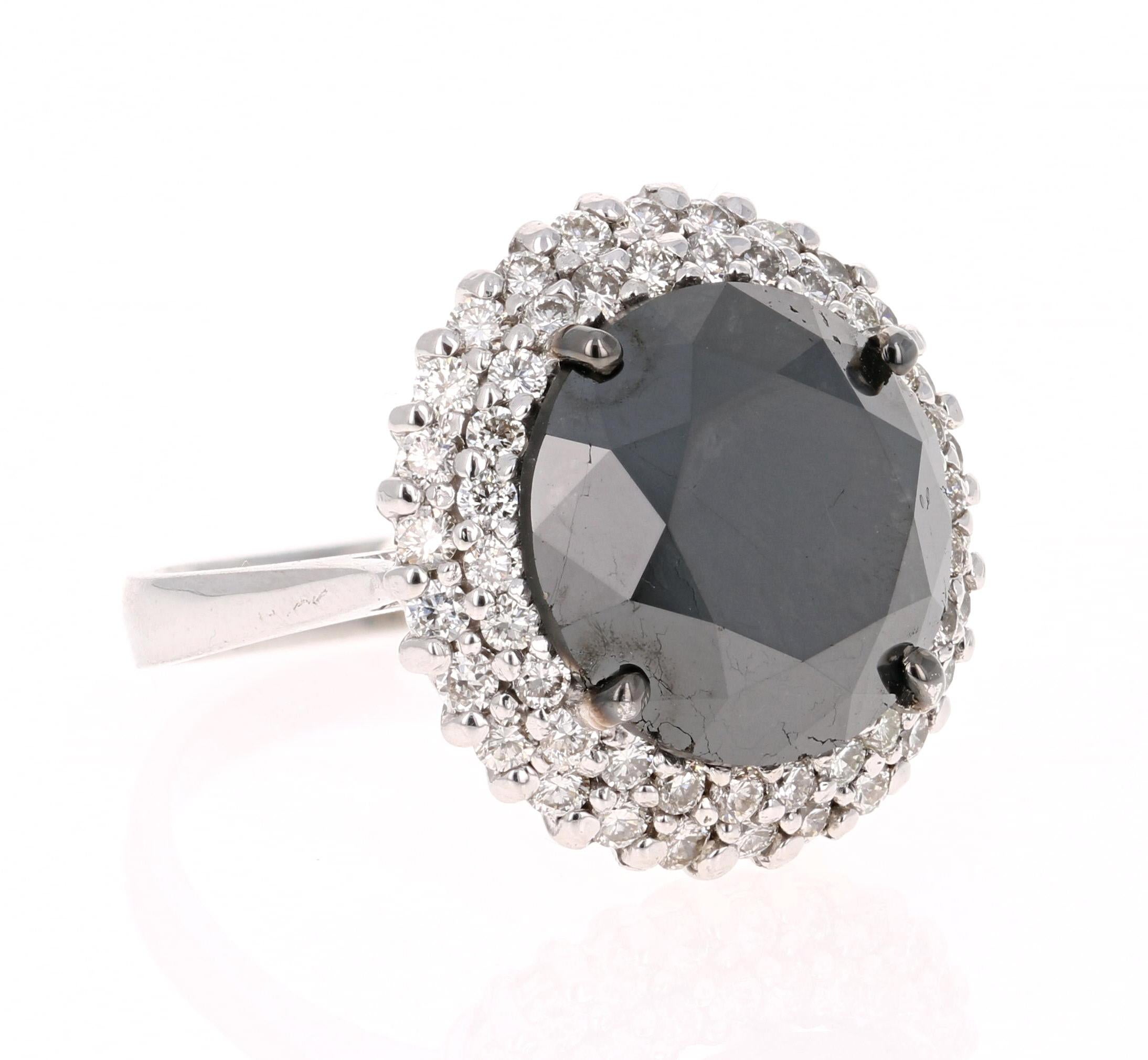 Stunning Black and White Diamond Cocktail Ring that is a nothing but a Statement! 

The Round Cut Black Diamond is 10.06 Carats and is surrounded by a double halo of 51 Round Cut Diamonds weighing 1.00 Carat. (Clarity: VS, Color: H) The total carat
