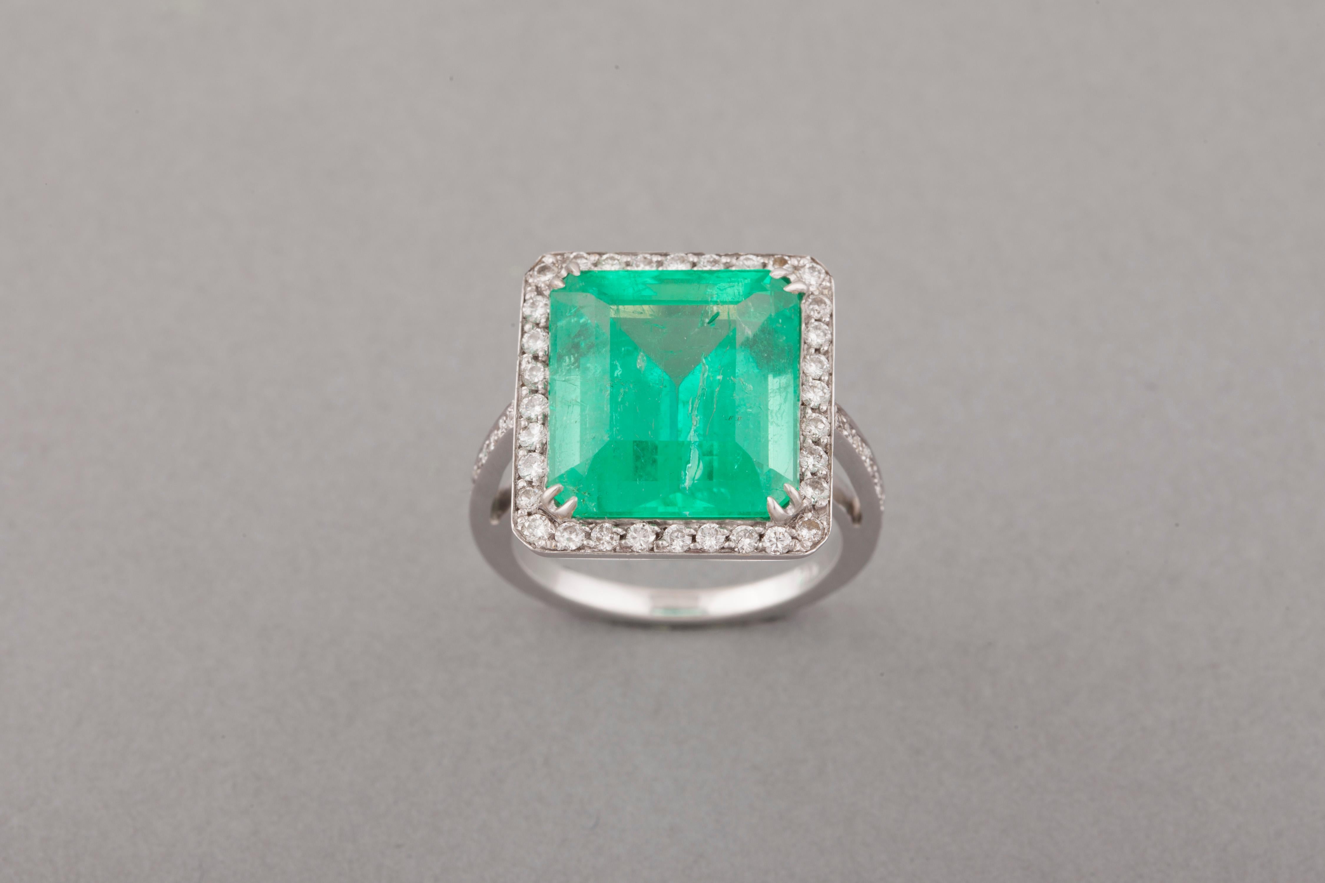 Beautiful and spectacular Diamonds and Emerald Ring. 
French made circa 1980.
The emerald weights 12.06 Carats.
The stone is big and also very clear.
The diamonds weights 1 carat.
Ring size : 7 US or 55 europe.
Total weight: 9.70 grams.
French marks