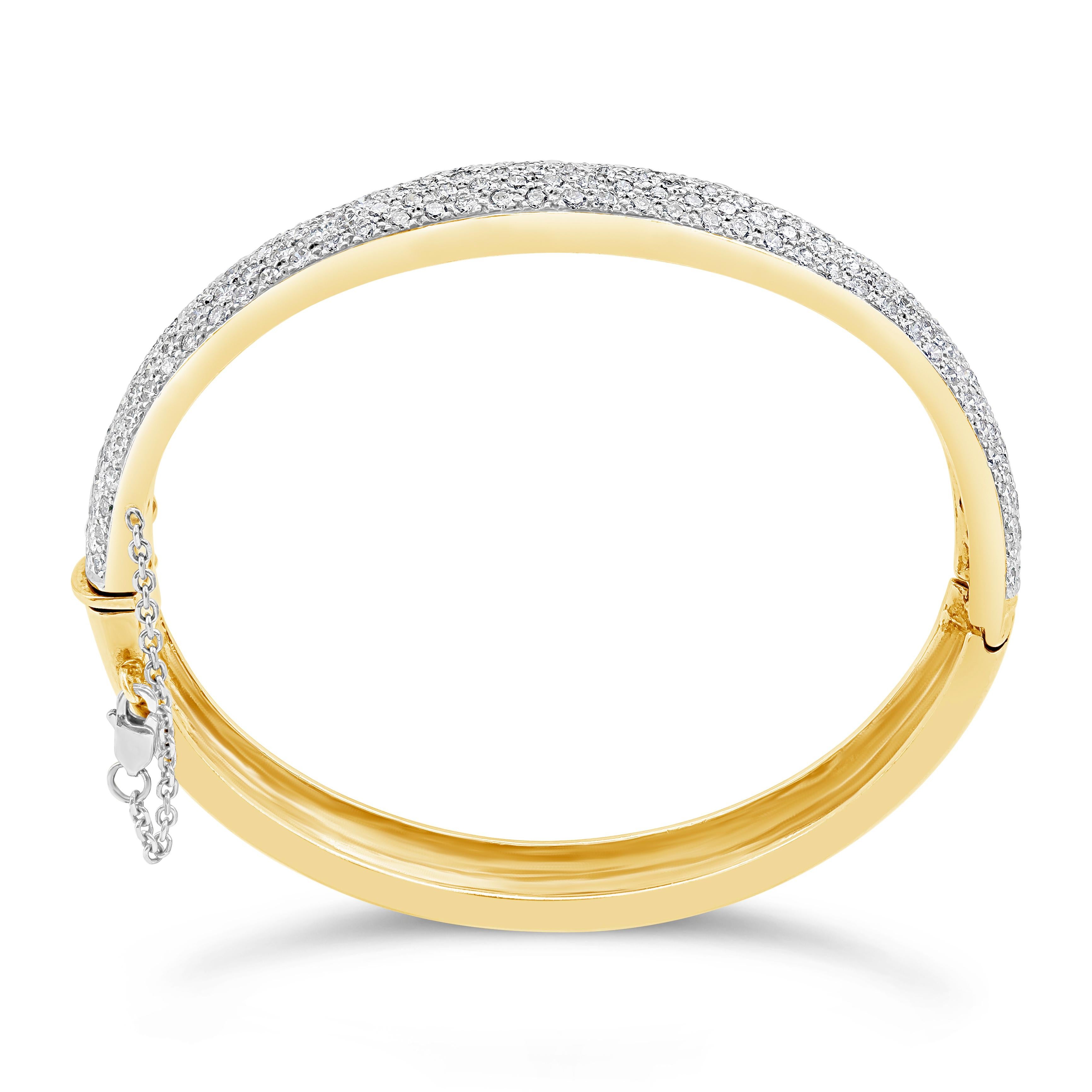 A gorgeous bangle bracelet encrusted with 11.07 carats of round brilliant diamonds. Made with 18K Yellow Gold. 7.75 inch inner circumference.

Roman Malakov is a custom house, specializing in creating anything you can imagine. If you would like to