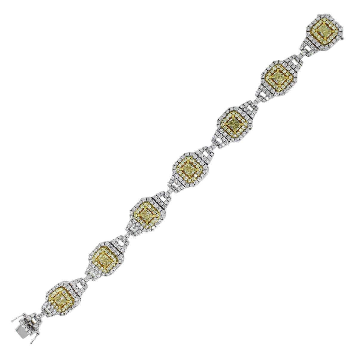 18k Two Tone 11.08ctw Diamond 7 Station Bracelet
Material: 18k Yellow Gold and 18k White Gold
Diamond Details: Approximately 3.80ctw of Yellow Diamonds. There are 7 larger, Radiant cut yellow Diamonds. Approximately 7.28ctw of Round Brilliant white