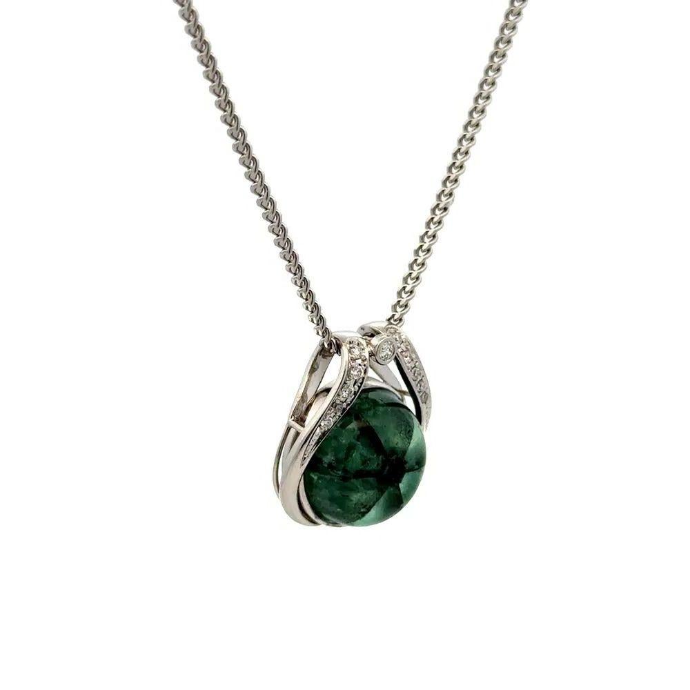 Simply Beautiful! Finely detailed Rare Trapiche Columbian Emerald and Diamond Vintage Pendant Necklace. Featuring a securely nestled Hand set 11.08 Carat Trapiche Columbian Emerald Gemstone. Accented by Diamonds, weighing approx. 0.15tcw. Hand