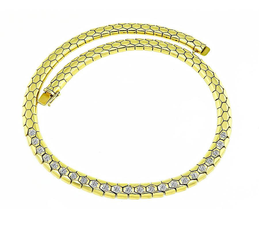 This is an elegant 14k yellow gold chain necklace. The necklace is set with sparkling round cut diamonds that weigh approximately 1.10ct. The color of these diamonds is G with VS clarity. The necklace measures 7.5mm in width and 15 1/2 inches in
