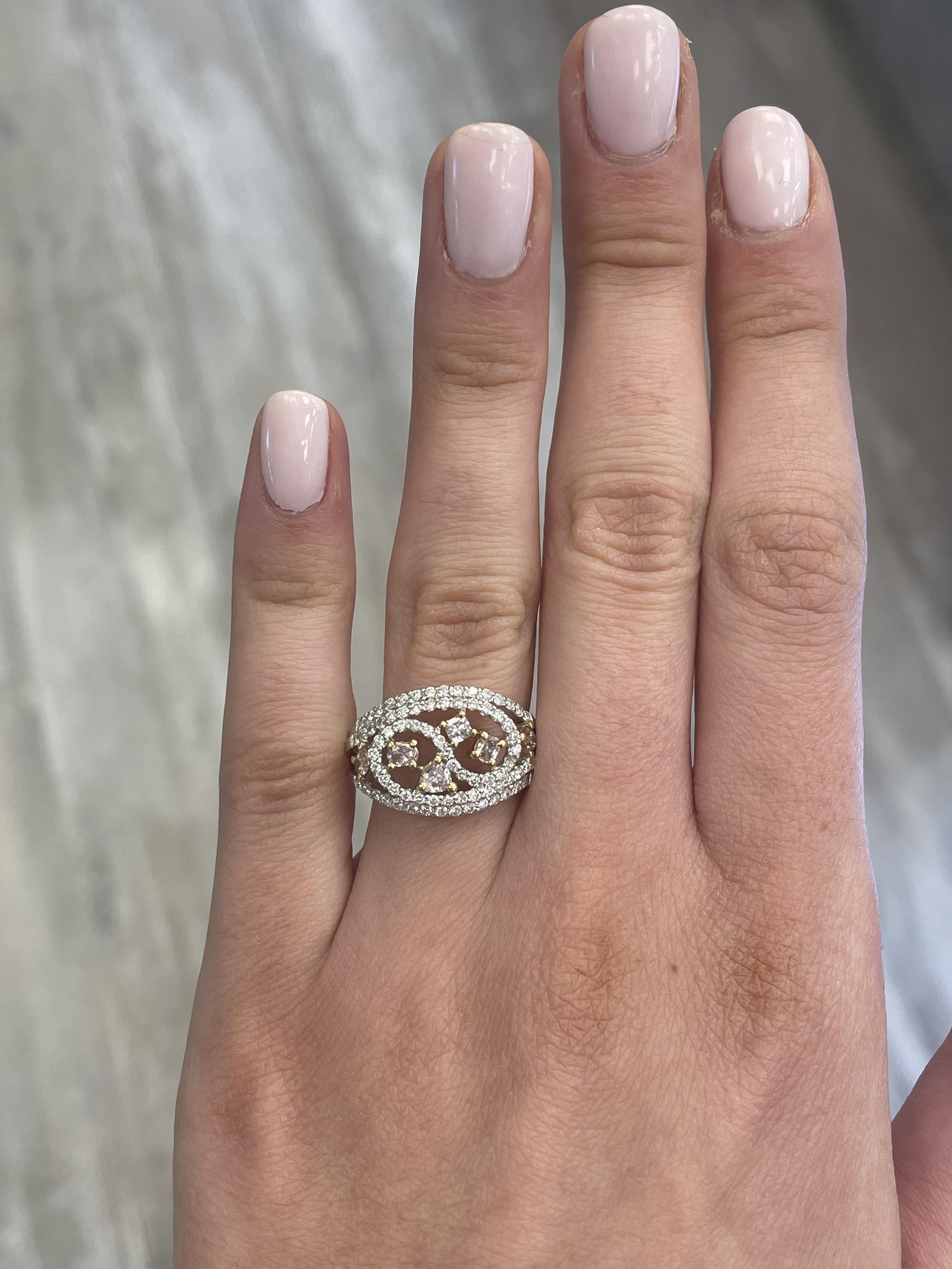 Stunning modern pink diamond cocktail ring. High jewelry by Alexander Beverly Hills.
1.10 carats total diamond weight.
2 multi pink color diamonds, 0.51 carats. Approximately Fancy Light Brownish Pink color and VS2/SI1 clarity. Complimented by 75