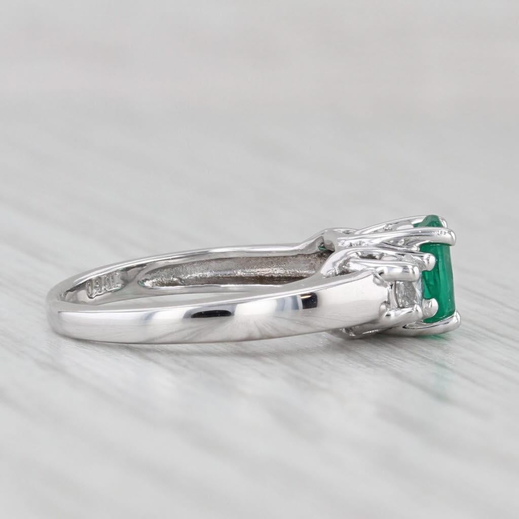 Gemstone Information:
- Natural Emerald -
Carats - 0.80ct 
Cut - Oval 
Color - Green
Treatment - Oiling

- Natural Diamonds -
Total Carats - 0.30ctw
Cut - Oval
Color - G - H
Clarity - VS1 - VS2

Metal: 14k White Gold
Weight: 2.9 Grams 
Stamps:
