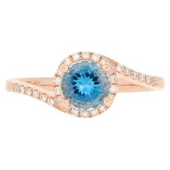 1.10ctw Round Cut Blue Topaz 
Diamond Ring, 14k Rose Gold Bypass Halo