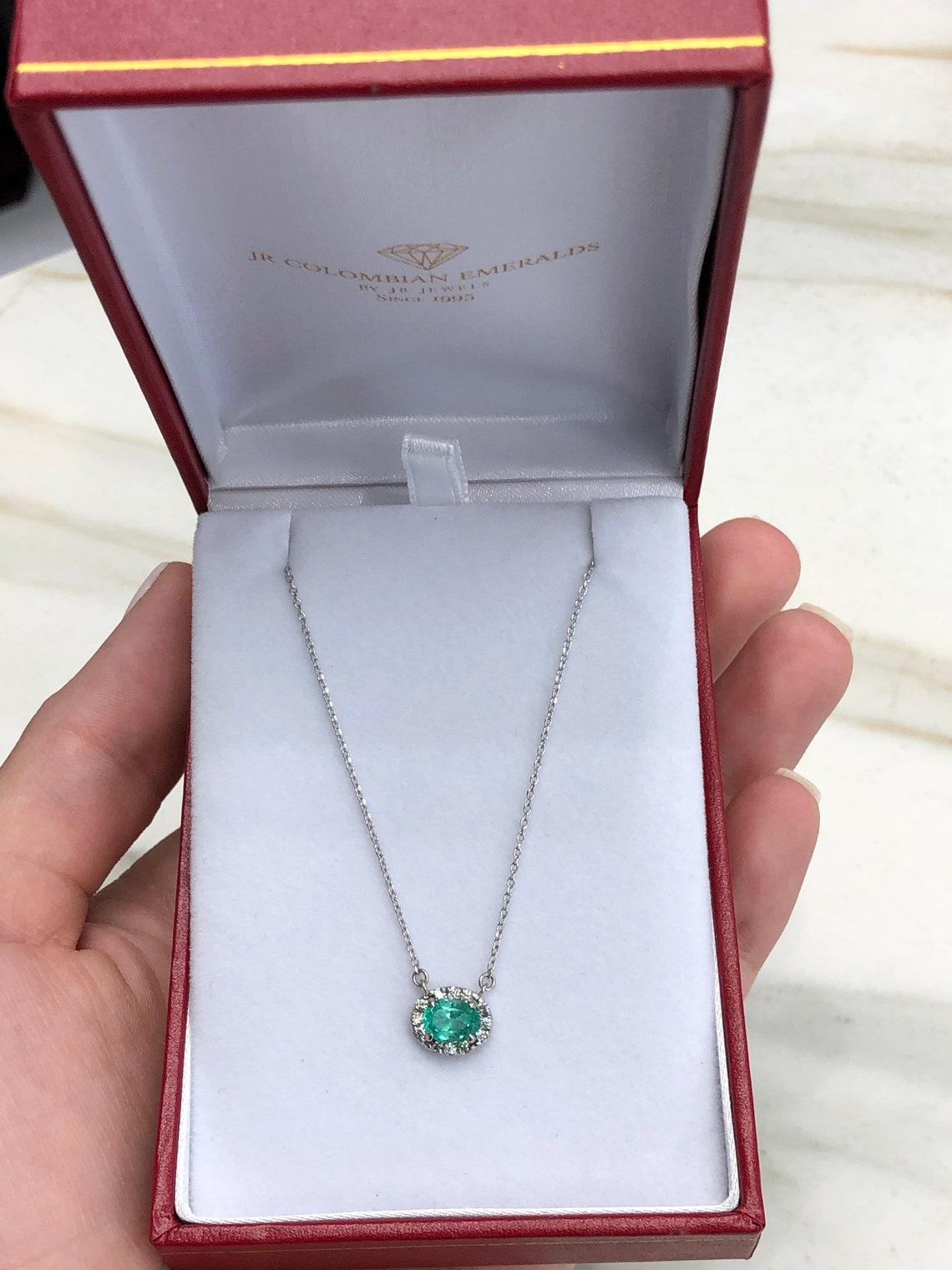 Modern 1.10tcw Natural Oval Emerald & Diamond Halo Pendant in 14k White Gold East For Sale