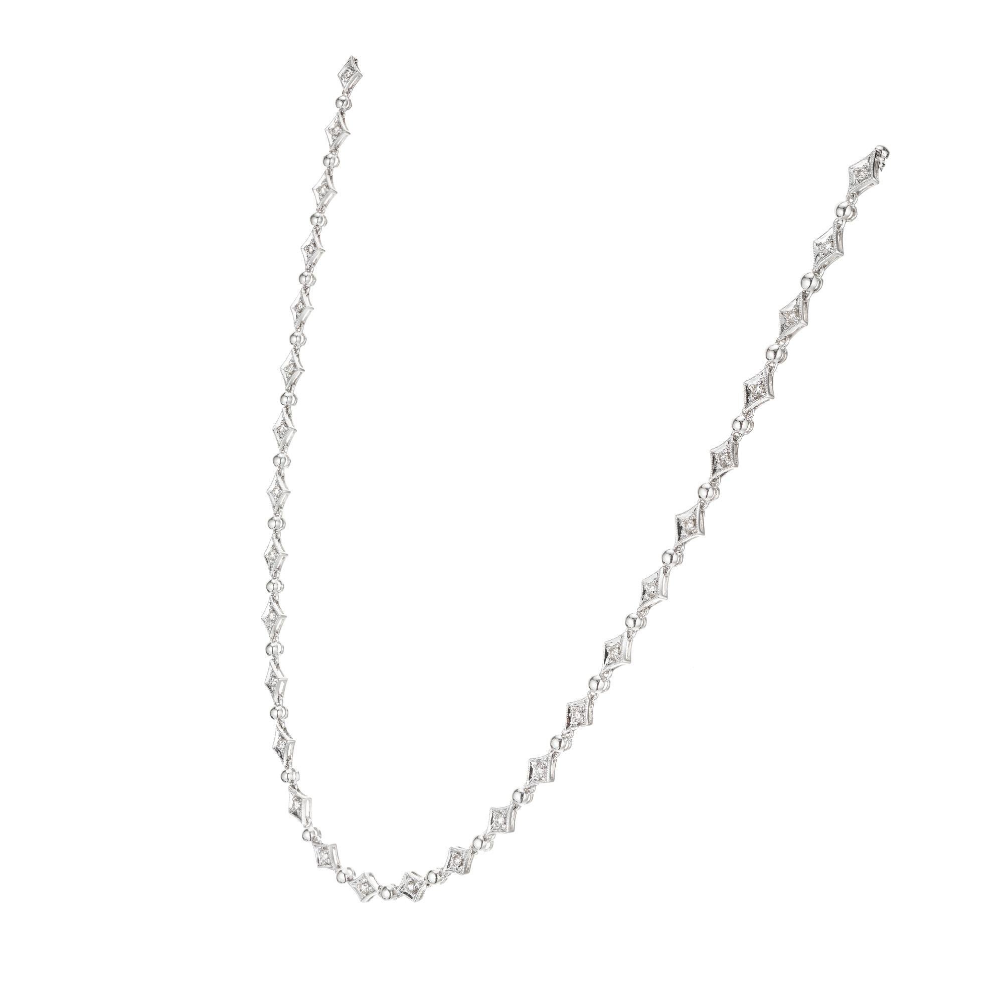 1950's Hinged Marquis Diamond link necklace. 39 full cut diamonds set in 14k white gold marquise settings. 17.5 inches.  

39 full cut diamonds, approx. total weight 1.11cts, H, VS
14k White gold
15.6 grams
Tested and stamped: 14k
Width: