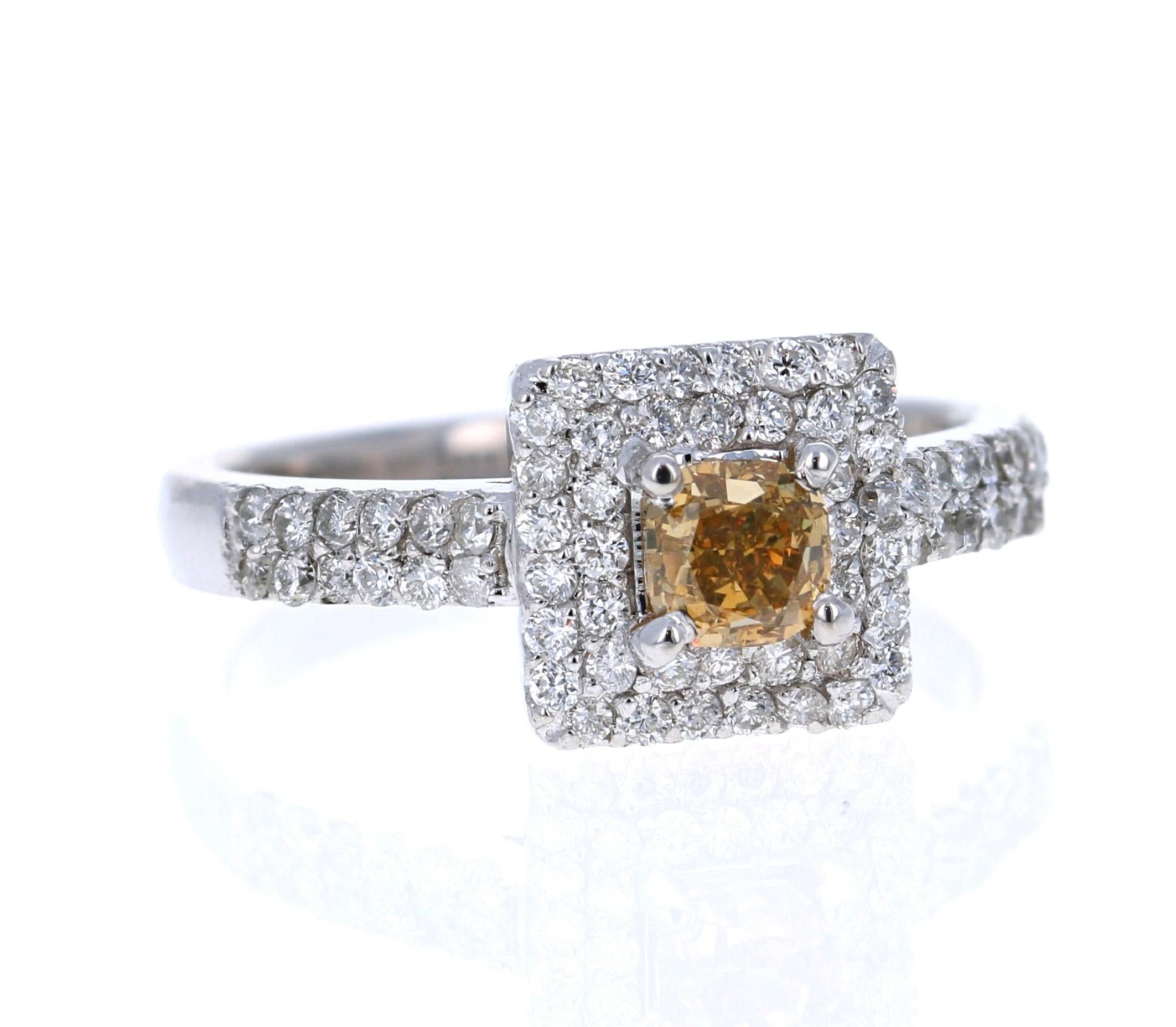 This beautiful engagement ring has a Cushion Cut Champagne Diamond that weighs 0.56 carats with a clarity of VS. It has a halo of 64 Round Cut Diamonds that weigh 0.55 carats (SI-F).The total carat weight of the ring is 1.11 carats. 

It is