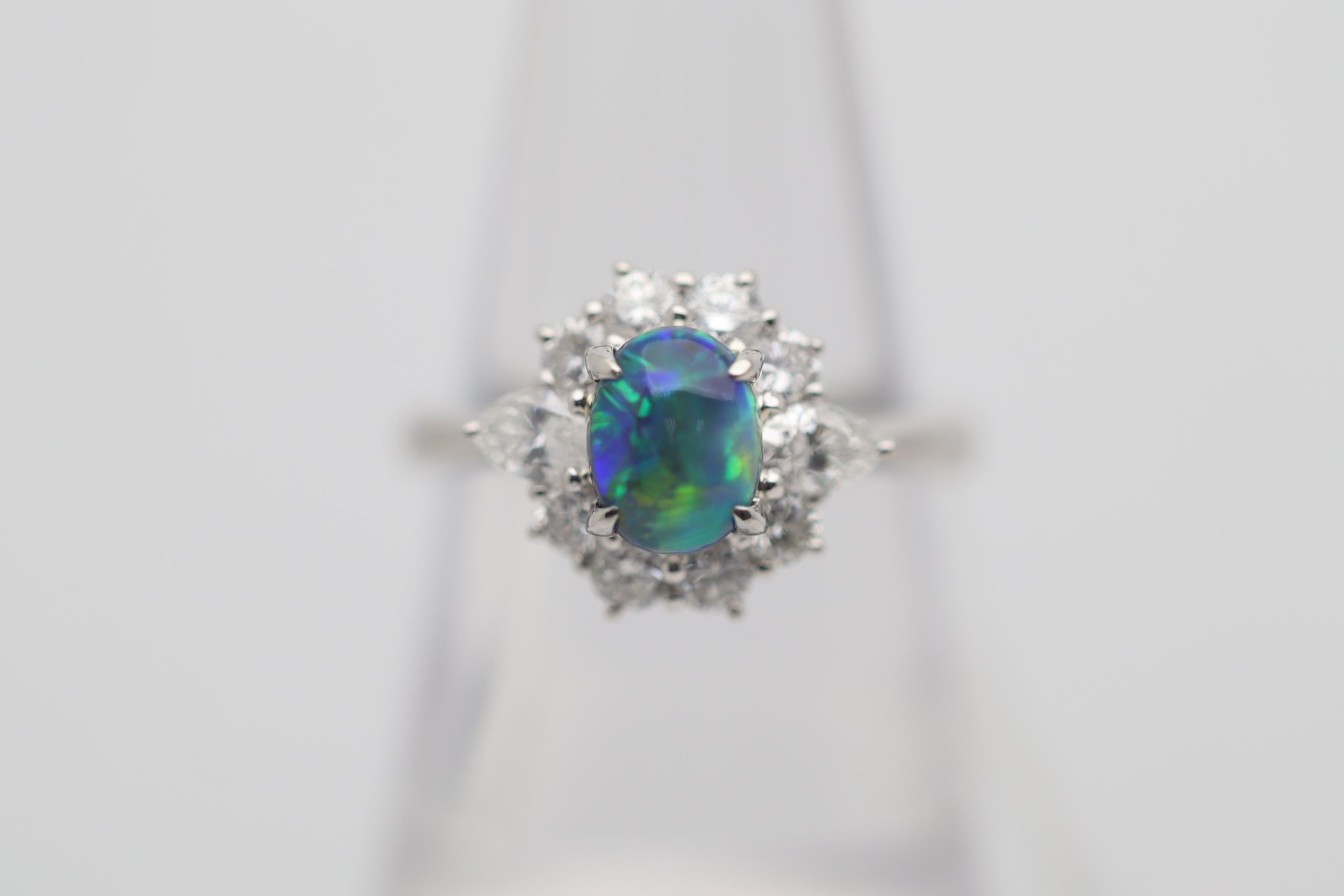 What it lacks in size it makes up in quality and beautiful color! This gem black opal weighs a respectable 1.11 carats and has stunning play-of-color. Bright and intense flashes of primarily green and blue, as well as orange and yellow roll across