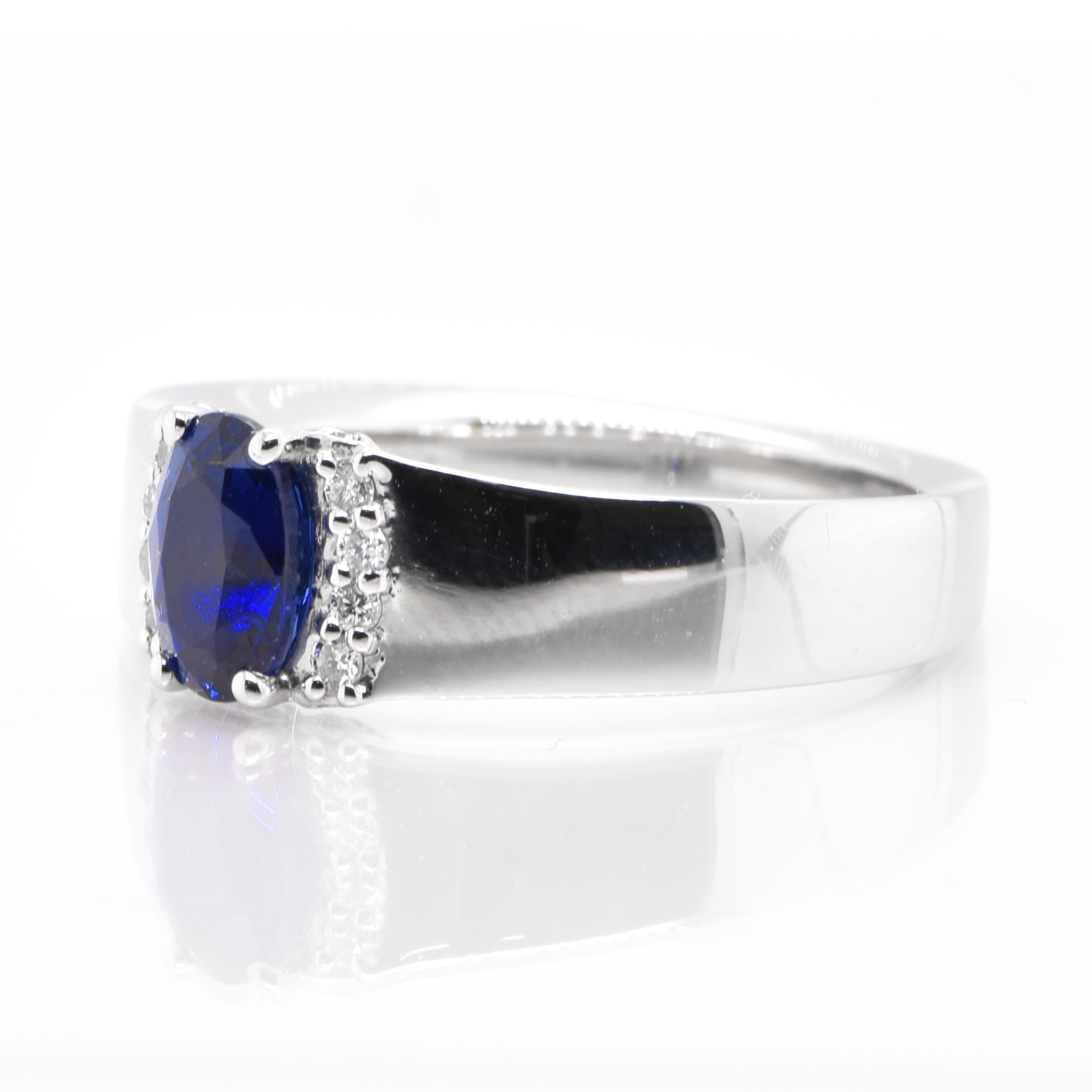 A beautiful Band Ring featuring a 1.11 Carat, Natural, Blue Sapphire and 0.18 Carats of Diamond Accents set in Platinum. Sapphires have extraordinary durability - they excel in hardness as well as toughness and durability making them very popular in