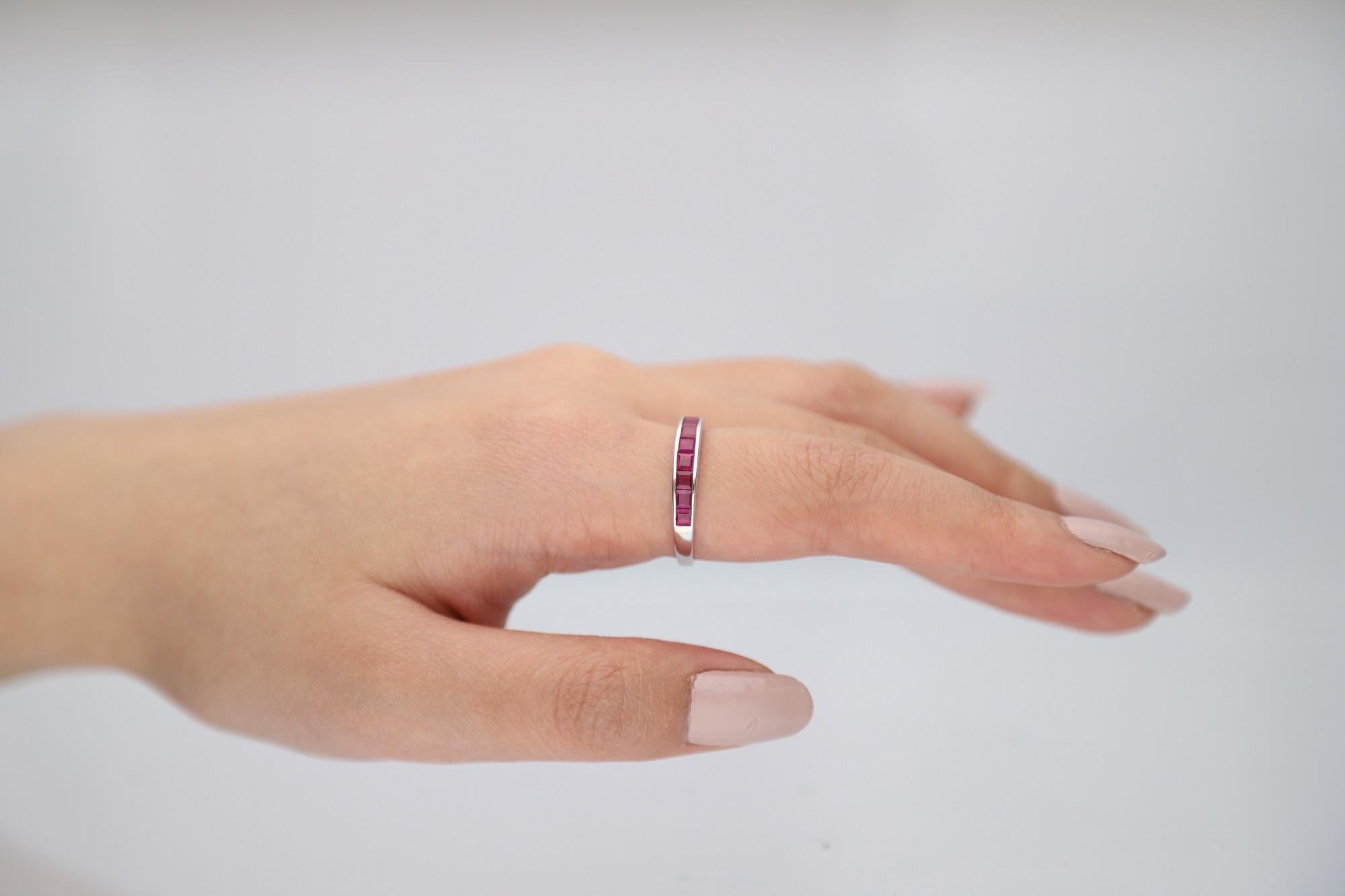 This ring features square-cut Thai rubies in a row in channel settings. Gin & Grace ring is crafted of 14-karat White gold with a highly polished finish. Gemstone colors: Pink Gemstone shapes: Square Nine prong-set square-cut Thai rubies each