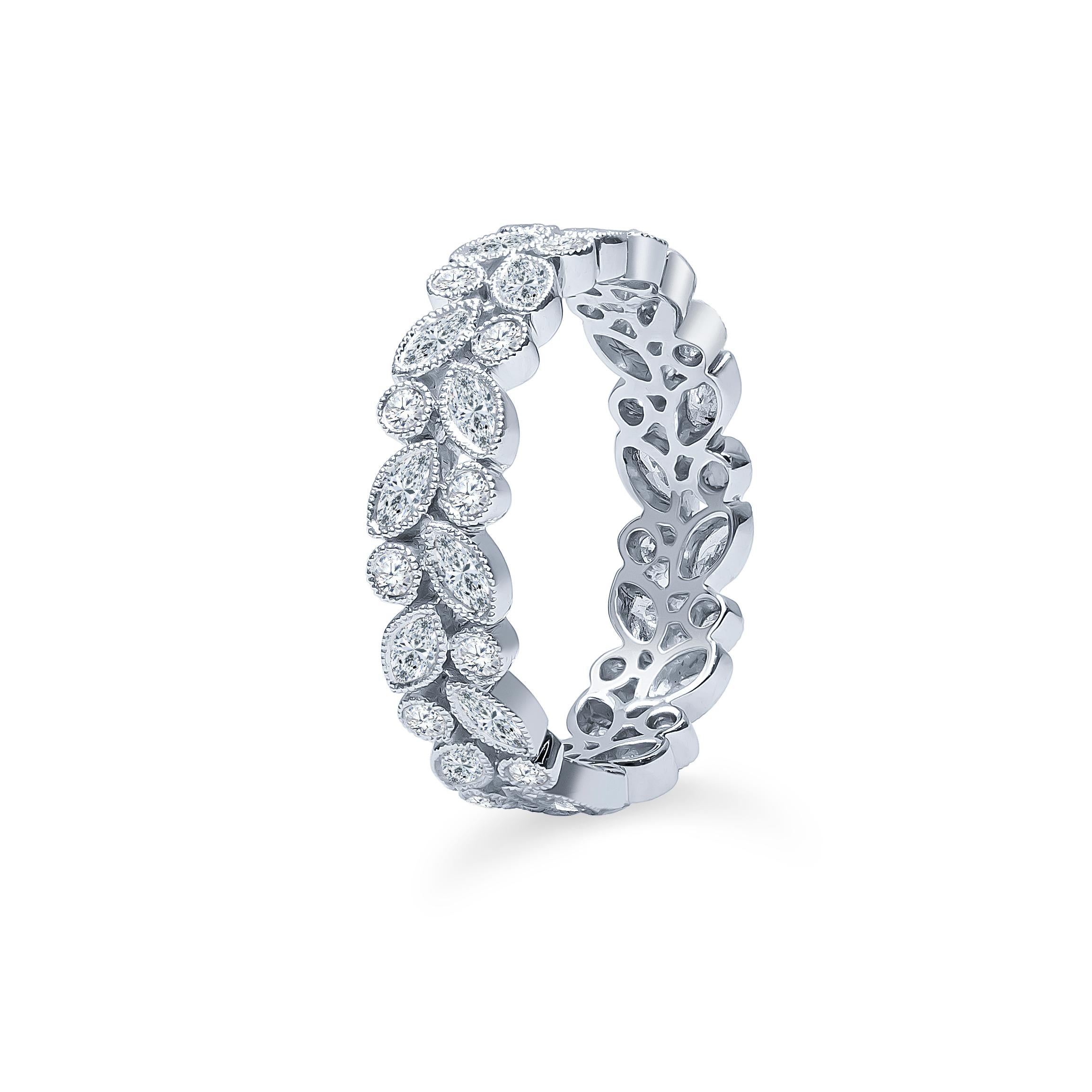 18K white gold eternity band with mix shape marquise and round brilliant diamonds, 0.78 carats of marquise cut and 0.33 carats of round brilliant cut set in bezels with milgrain borders, size 6.5.

Diamond quality: G-H color, VS2-SI1 clarity