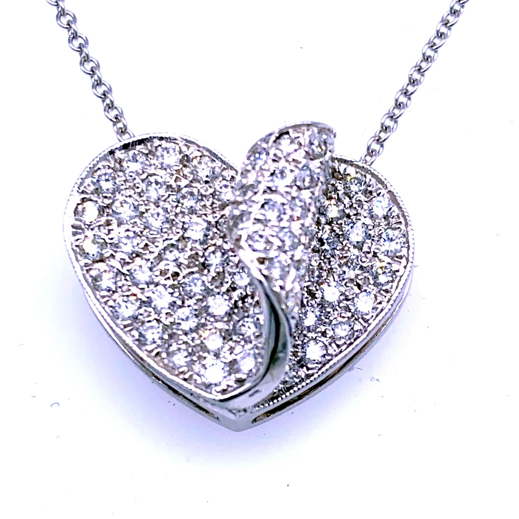 14K Gold Pave Set Diamond Heart Shape Leaf Pendant  with total weight of 1.11 Ct. 
Total Diamond Weight: 1.11 Ct
Total Necklace Weight: 7 gr
Pendant Size 20x17 mm - 9.5 mm Thickness
Chain Not included
