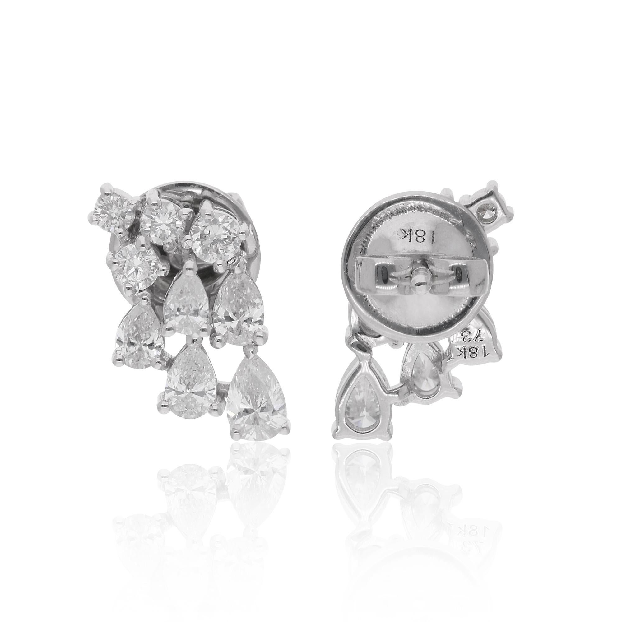 At the center of each earring gleams a brilliant pear-shaped diamond, flanked by delicate round-cut diamonds. The pear cut, with its graceful teardrop silhouette, adds a touch of timeless elegance, while the round-cut diamonds bring a classic