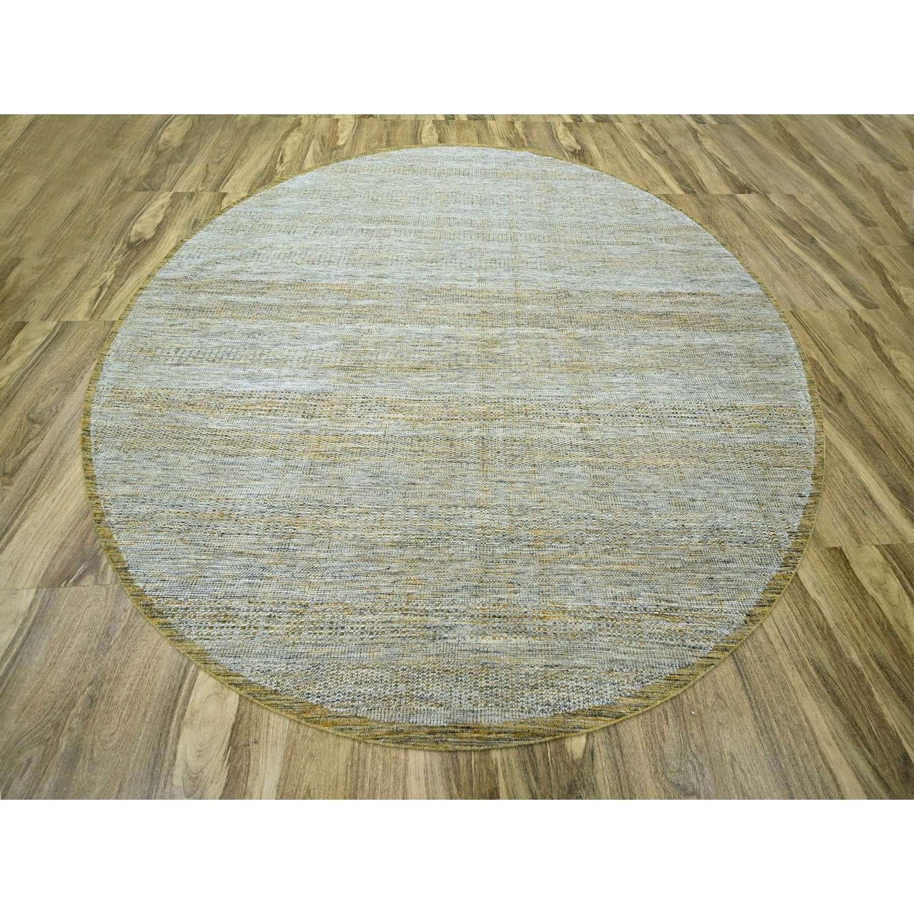 Nugget Gold, Pure Wool, Hand Knotted, Oxidized and Distressed Grass Design with Exposed Warps, Round, Oriental Rug
Primary materials: Wool
Latex: No Pile 
height: 0.25 Inches
Style: Contemporary
Primary color: Gold
Secondary colors: Ivory
Pattern: