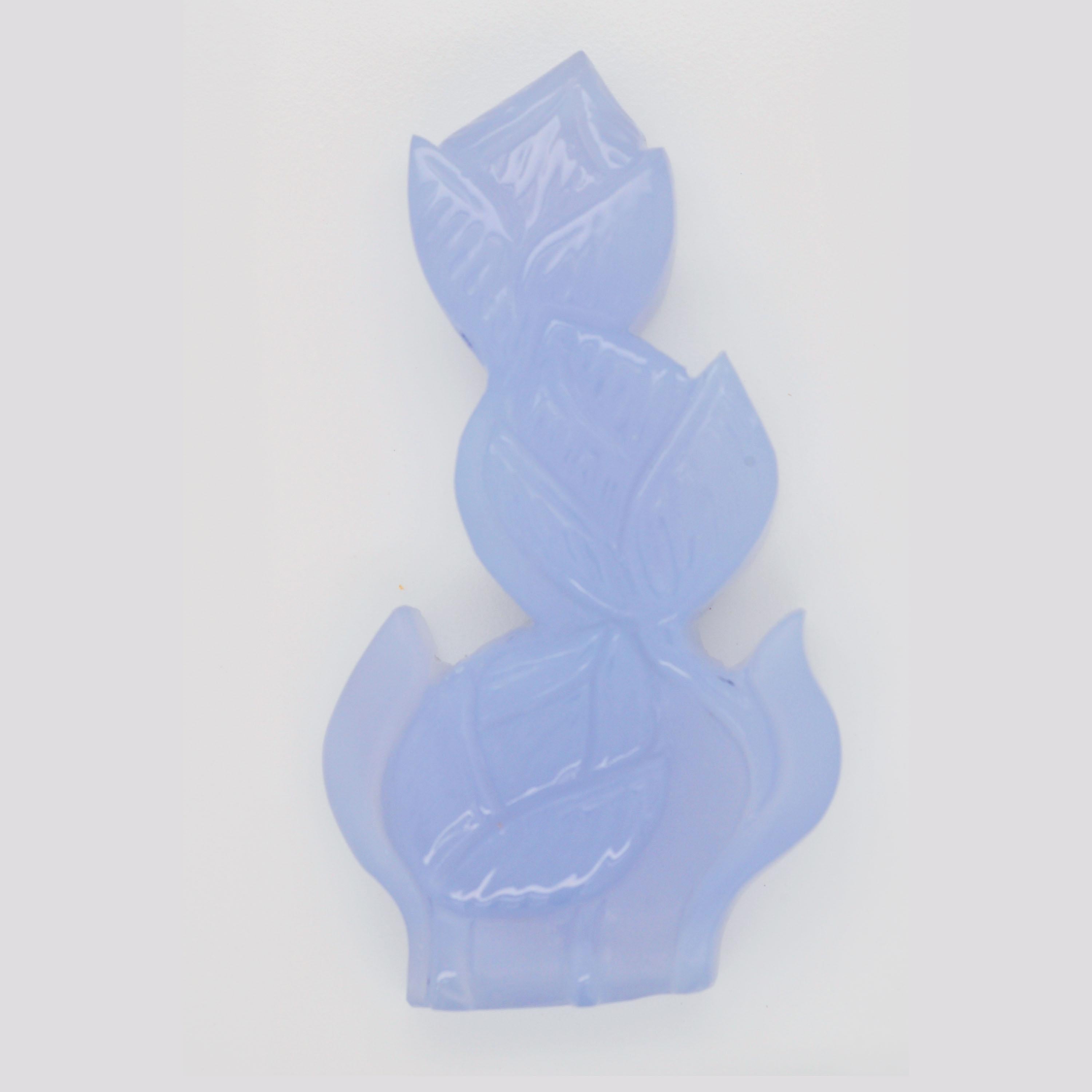 The 111.36 carats Blue Chalcedony Hand-Carved Flower Pendant Necklace is an exquisite piece of jewelry that showcases the beauty of natural gemstones and skilled craftsmanship. The pendant features a large, smooth, and translucent Blue Chalcedony